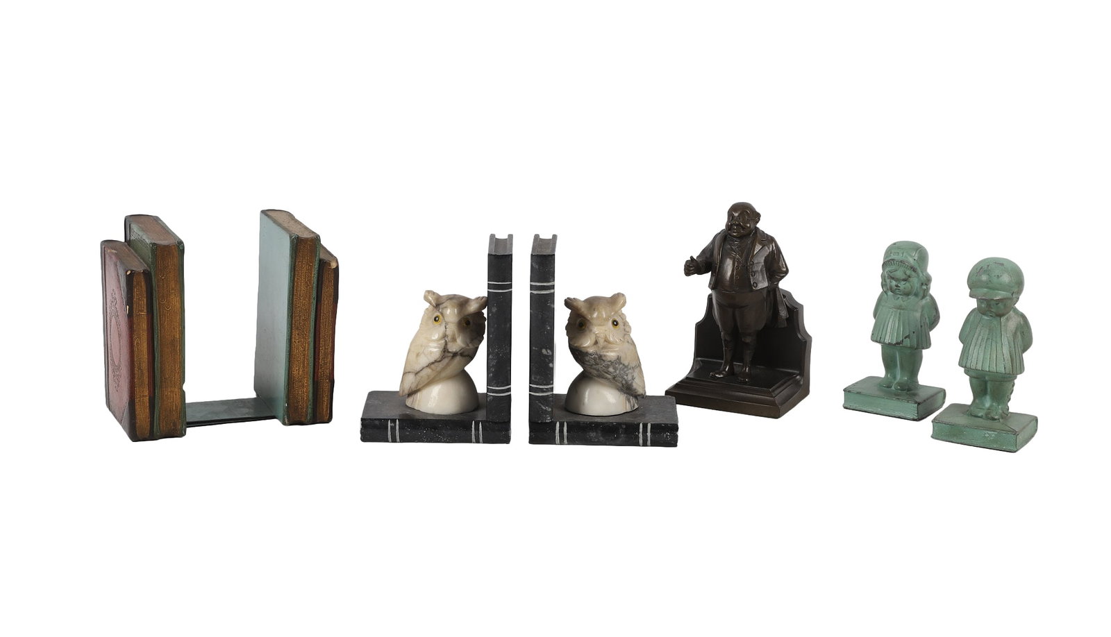 Collection of Bookends: Collection of Bookends Lot of vintage bookends including a pair of metal faux books, alabaster owls with beaded eyes, metal boy & girl figural bookends, and a single metal bookend of Mr. Pickwick. Tal