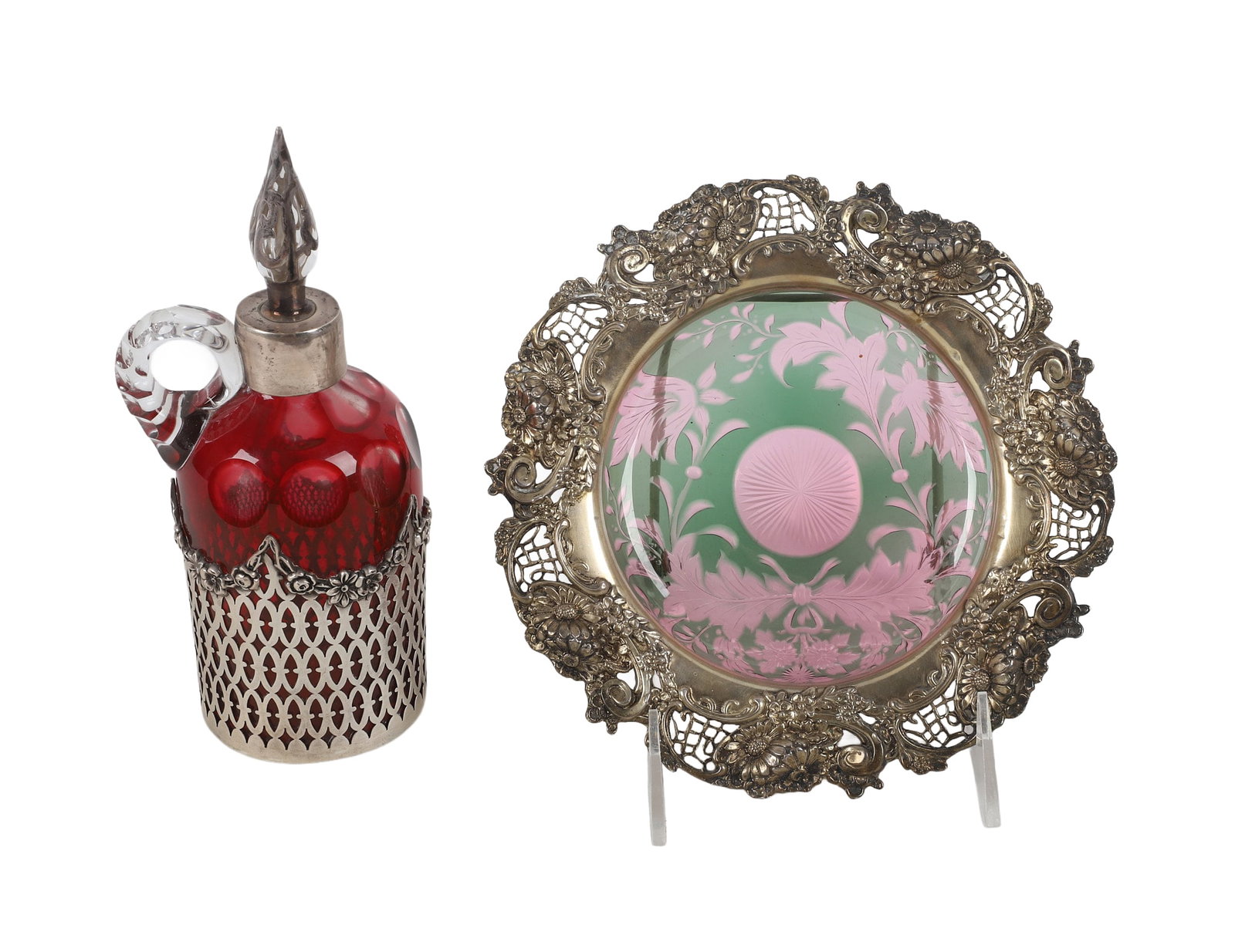 (2) Sterling Silver Overlay: (2) Sterling Silver Overlay Pair of Art Nouveau sterling silver overlay including a cranberry cut glass perfume/toilet bottle with pierced form & stopper along with a green cut glass catchall with ste