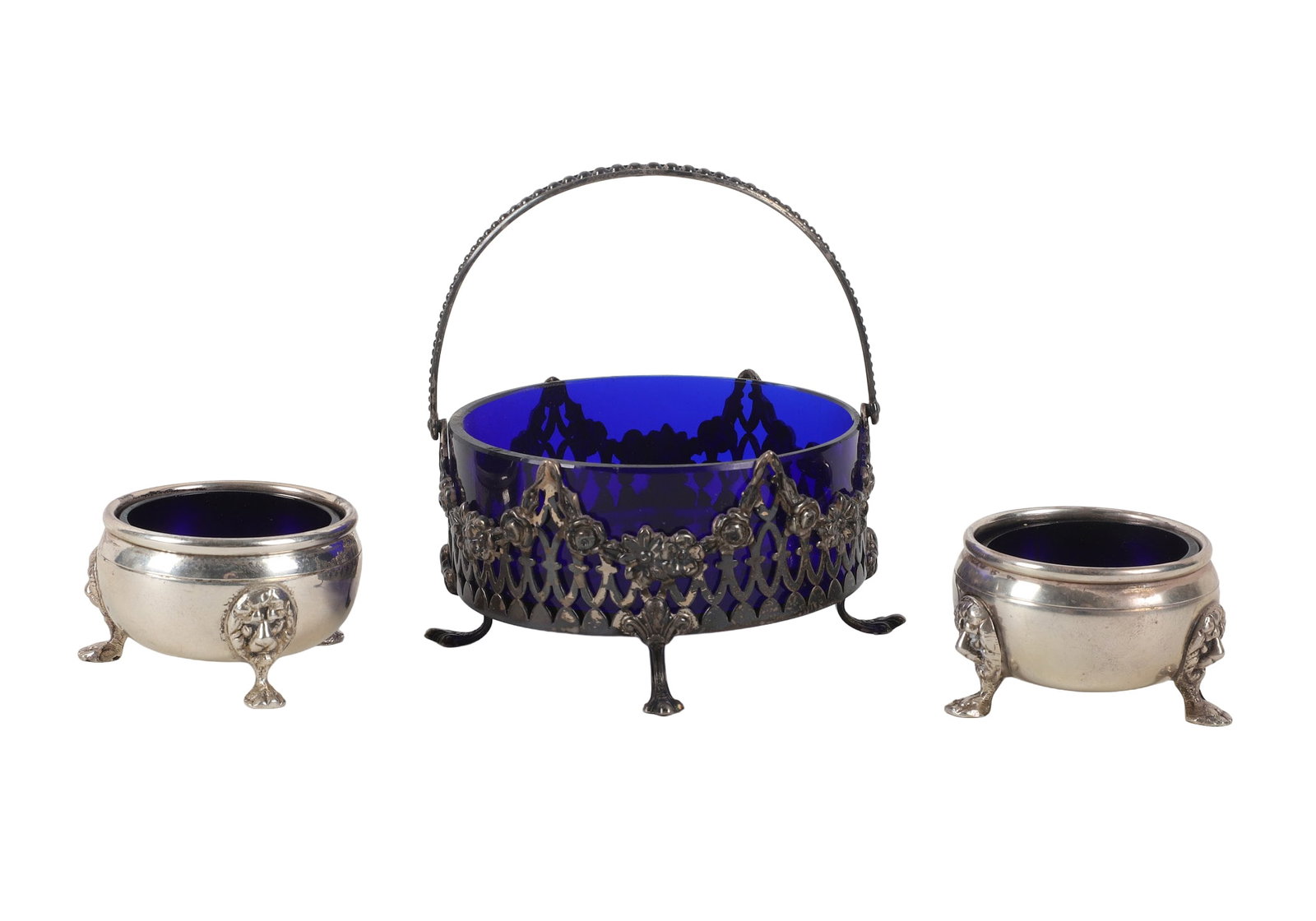 (3) Sterling & Colbalt Glass: (3) Sterling & Colbalt Glass Set sterling silver handled sugar with pierced exterior paired with (2) lion footed salt cellars. Larger pieces measures 3 3/4"W