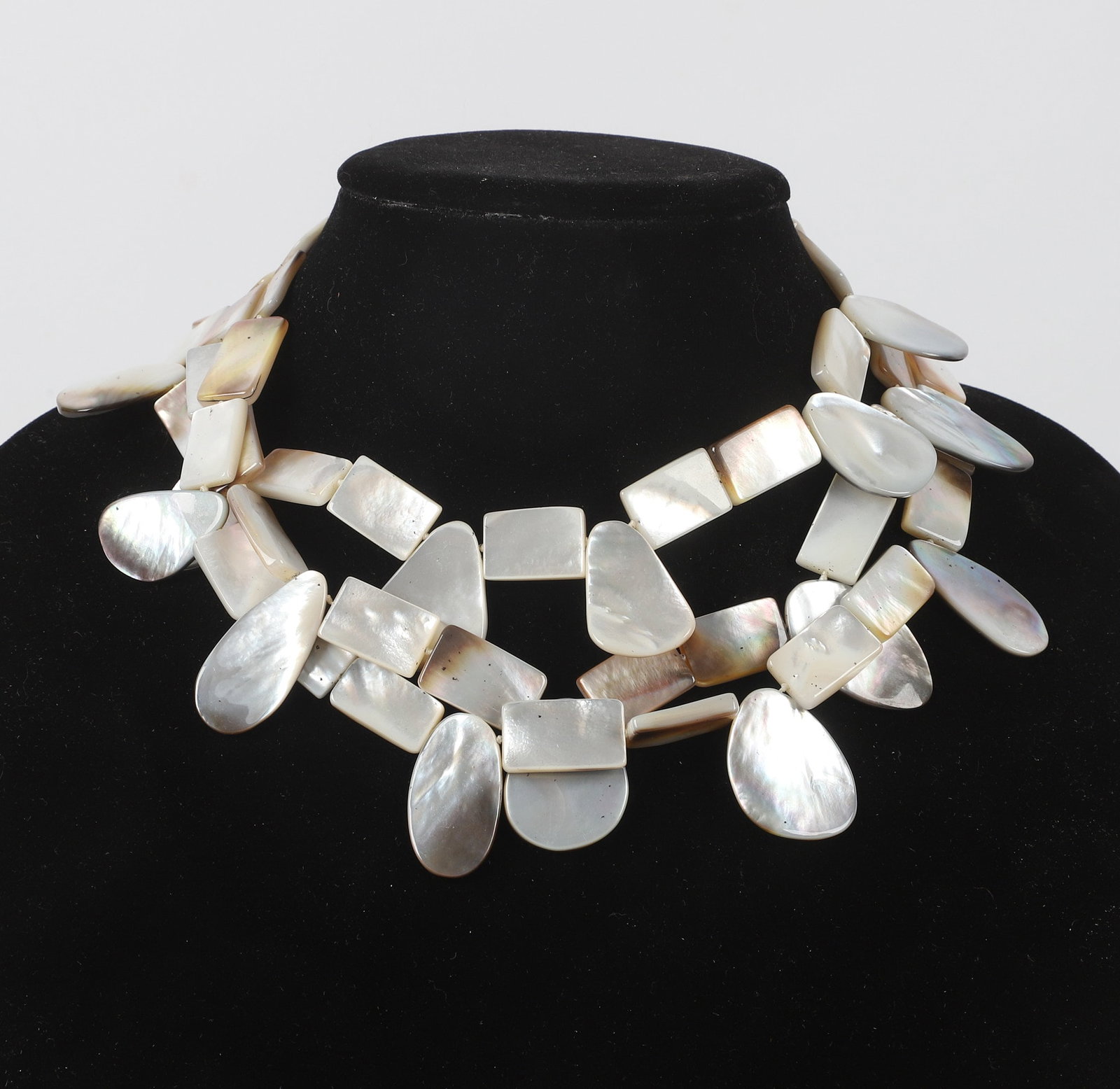 Signed Two Blonde Lizards Mother Of Pearl Necklace: Signed Two Blonde Lizards Mother Of Pearl Necklace Signed Two Blonde Lizards necklace, alternating mother of pearl shell links in white and gray tones, adjustable silver tone clasp closure.