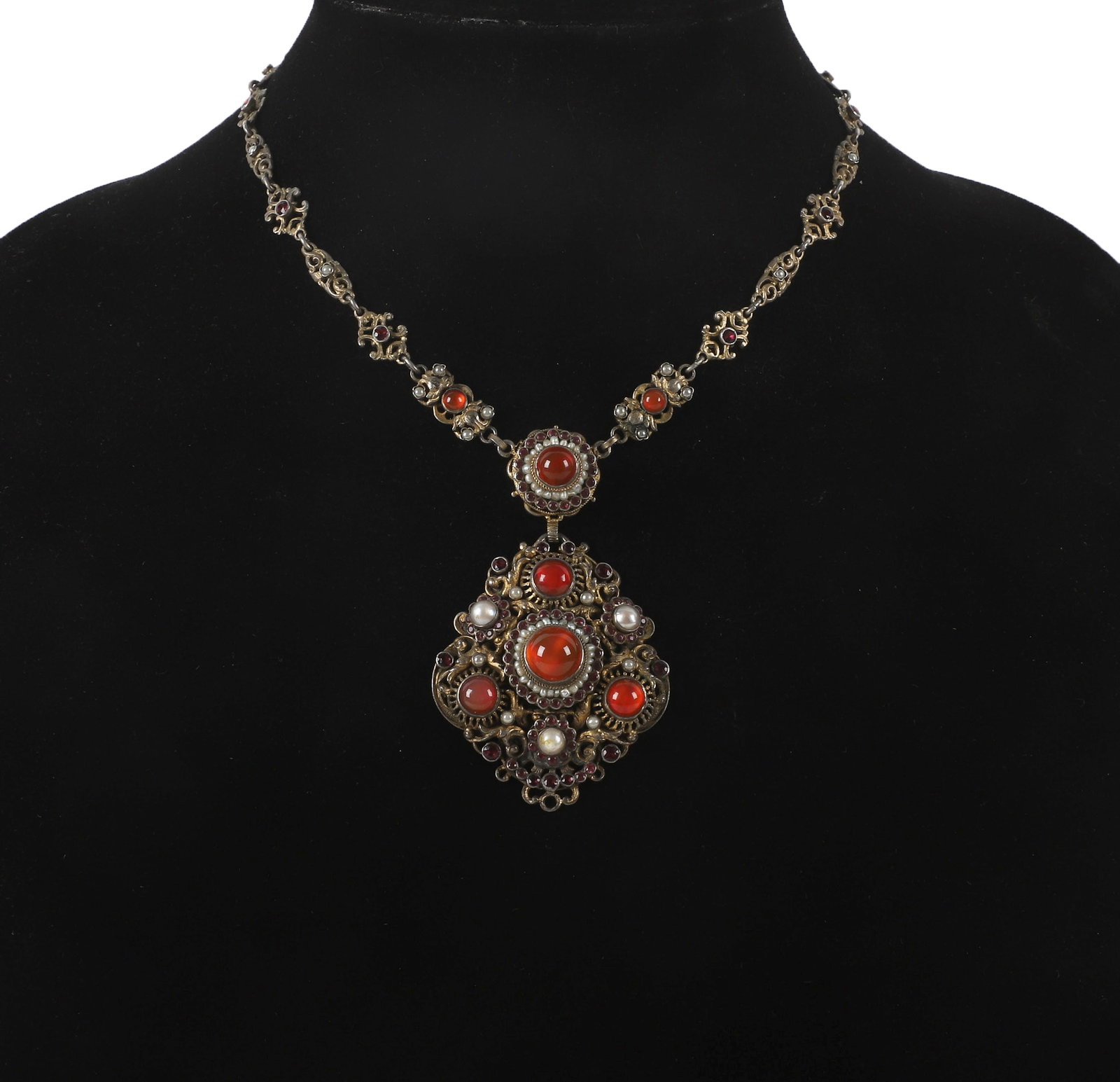 900 Silver Filigree Necklace With Orange Cabochon Stones and Seed Pearls: 900 Silver Filigree Necklace With Orange Cabochon Stones and Seed Pearls 900 Silver necklace with a large pendant with orange cabochon stones, garnets and seed pearls, marked "900" on clasp, 10" long