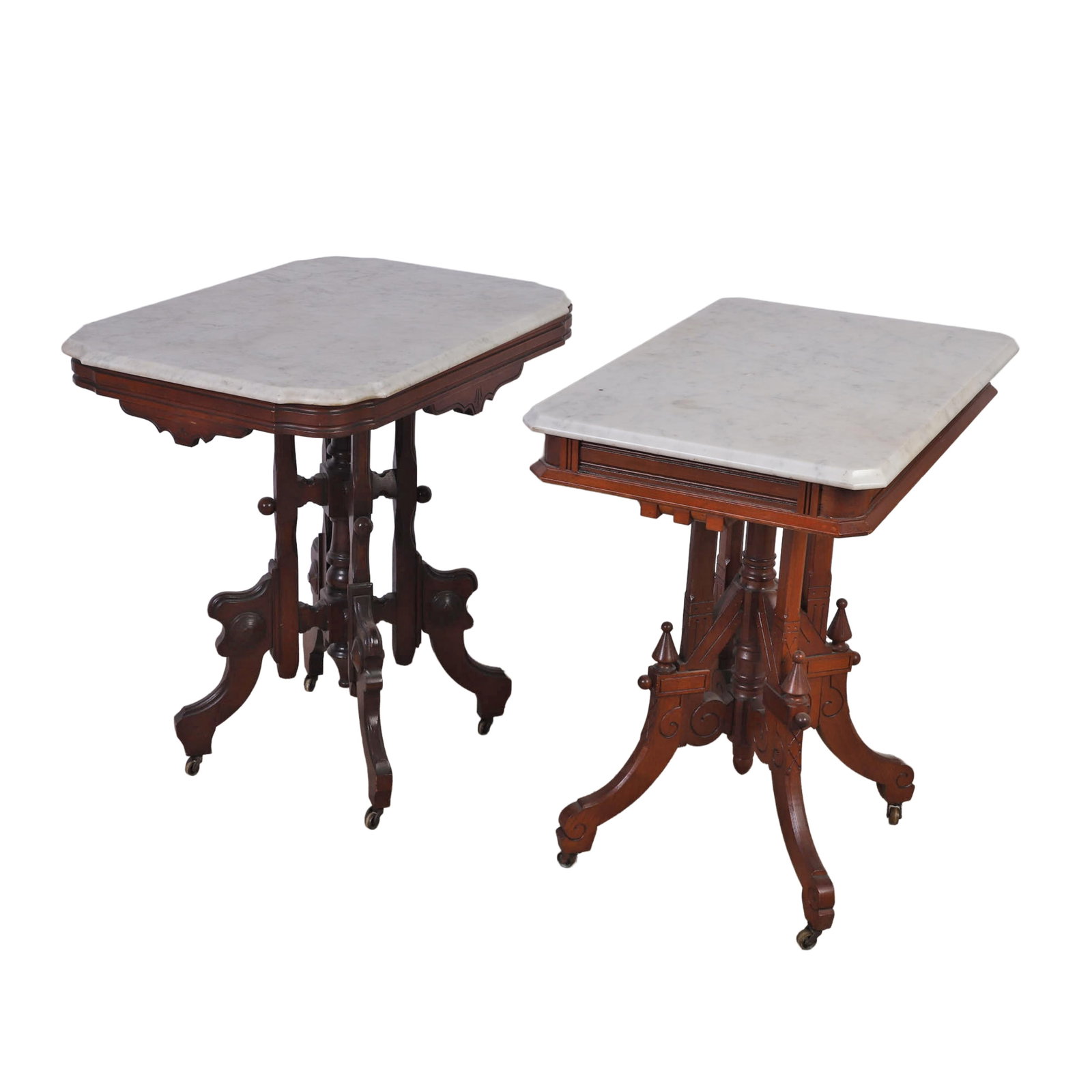 (2) Victorian Marble Top Parlor Tables: (2) Victorian Marble Top Parlor Tables (2) Victorian style marble top parlor tables one with serpentine form marble top, each on carved walnut pedestal bases with scrolling supports, finials and caste