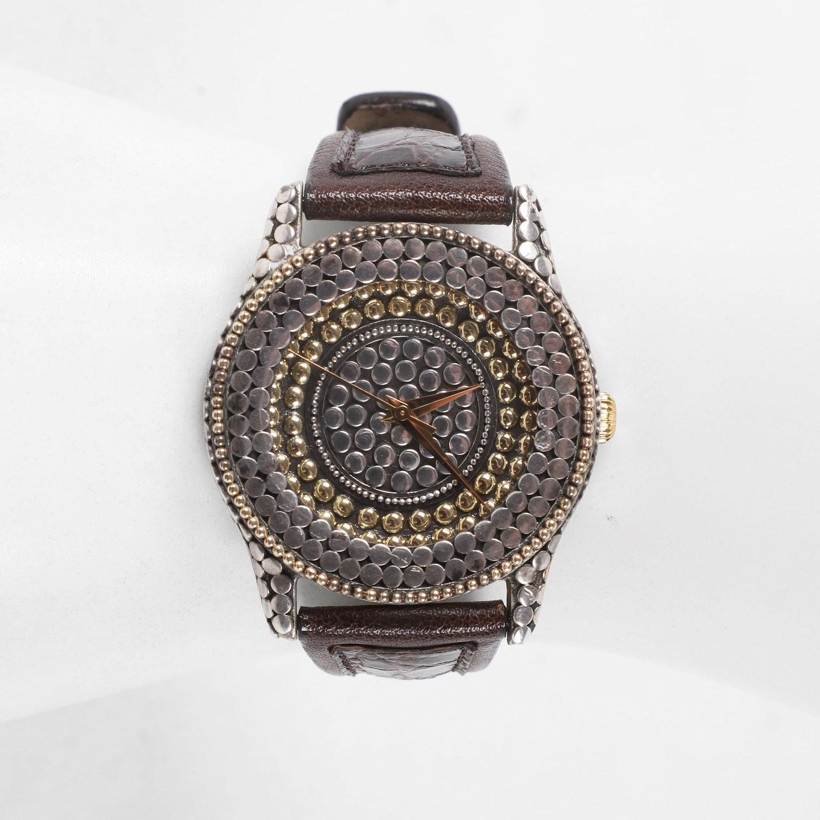John Hardy Sterling Silver Watch: John Hardy Sterling Silver Watch John Hardy watch having a sterling dot motif case and dial with gold tone hands and brown leather strap, quartz movement, marked on back of case.