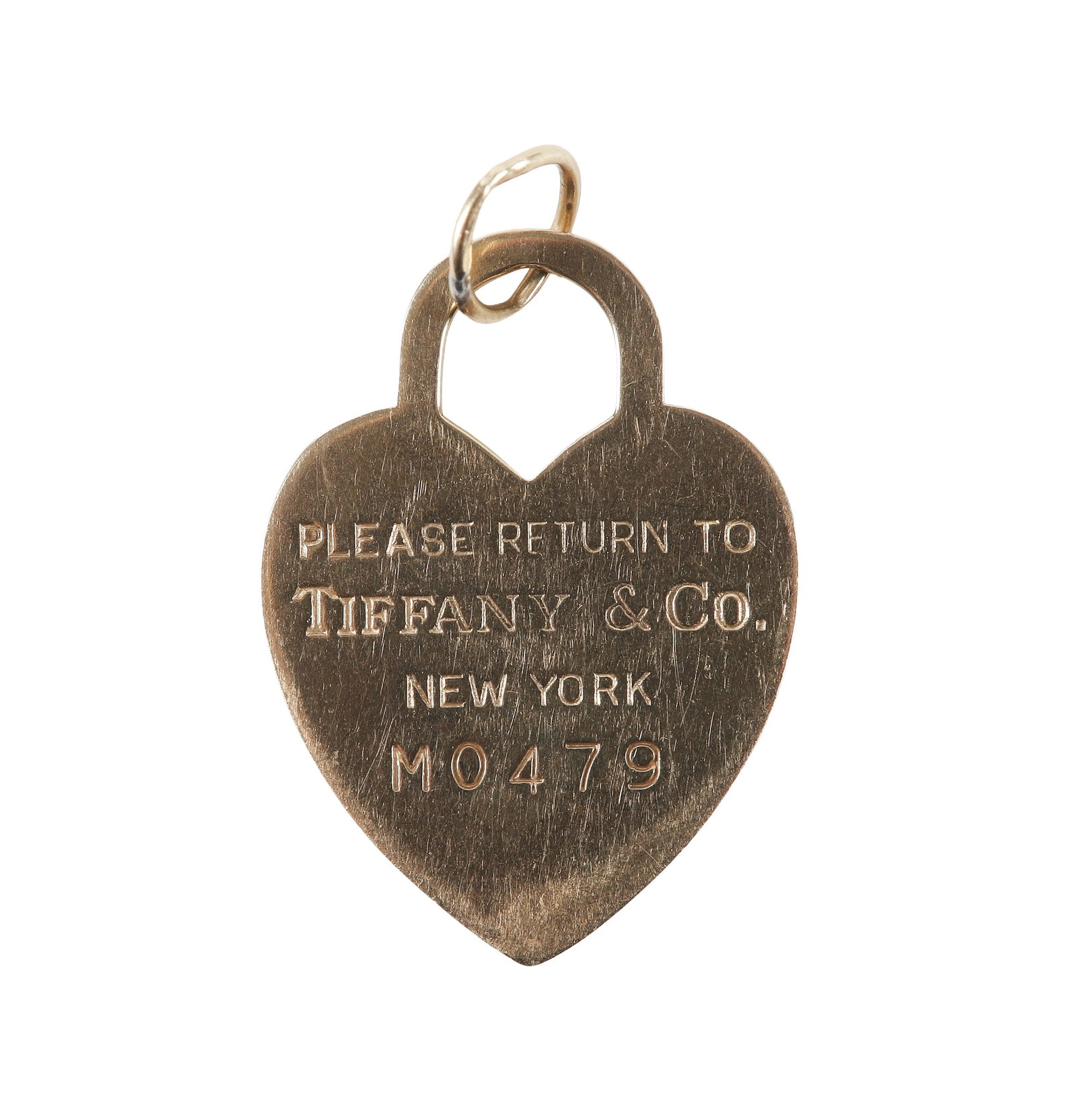 Tiffany & Co. 14 K Gold Heart Tag Charm: Tiffany & Co. 14 K Gold Heart Tag Charm Tiffany & Co. 14 K yellow gold "Please Return To Tiffany & o. New York" heart tag charm pendant, engraved M0479, marked 14 K 2.5 dwt