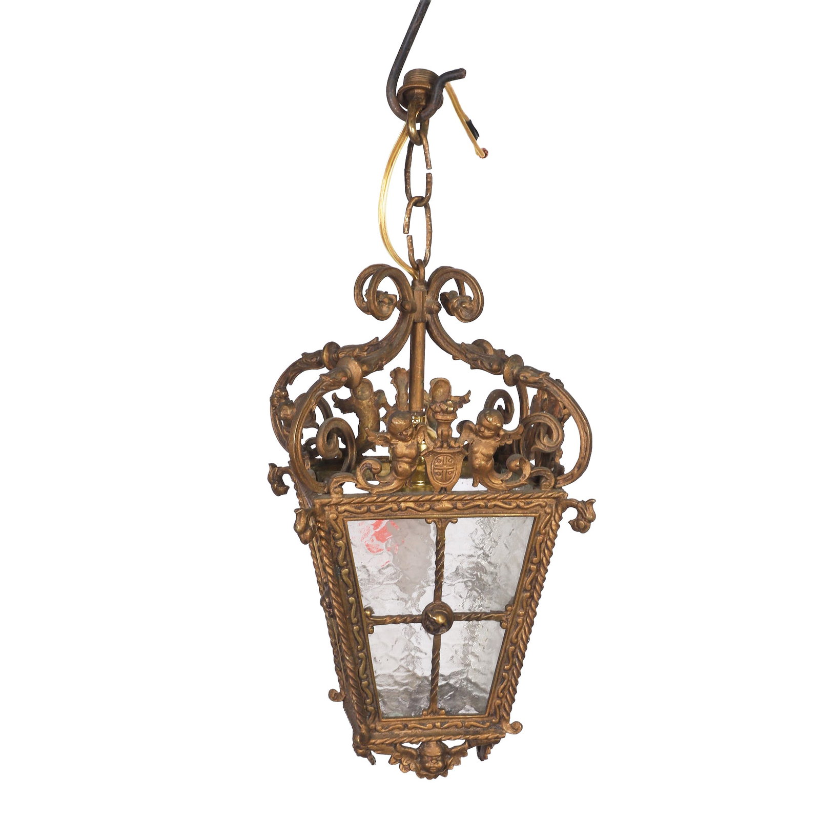 French style Pendant Lantern.: French style Pendant Lantern. French style single light ceiling pendant lamp in gilt metal with cherubs, shields and foliate scrolling details, glass pane sides. Approx. 18" L, 7 1/2" W.