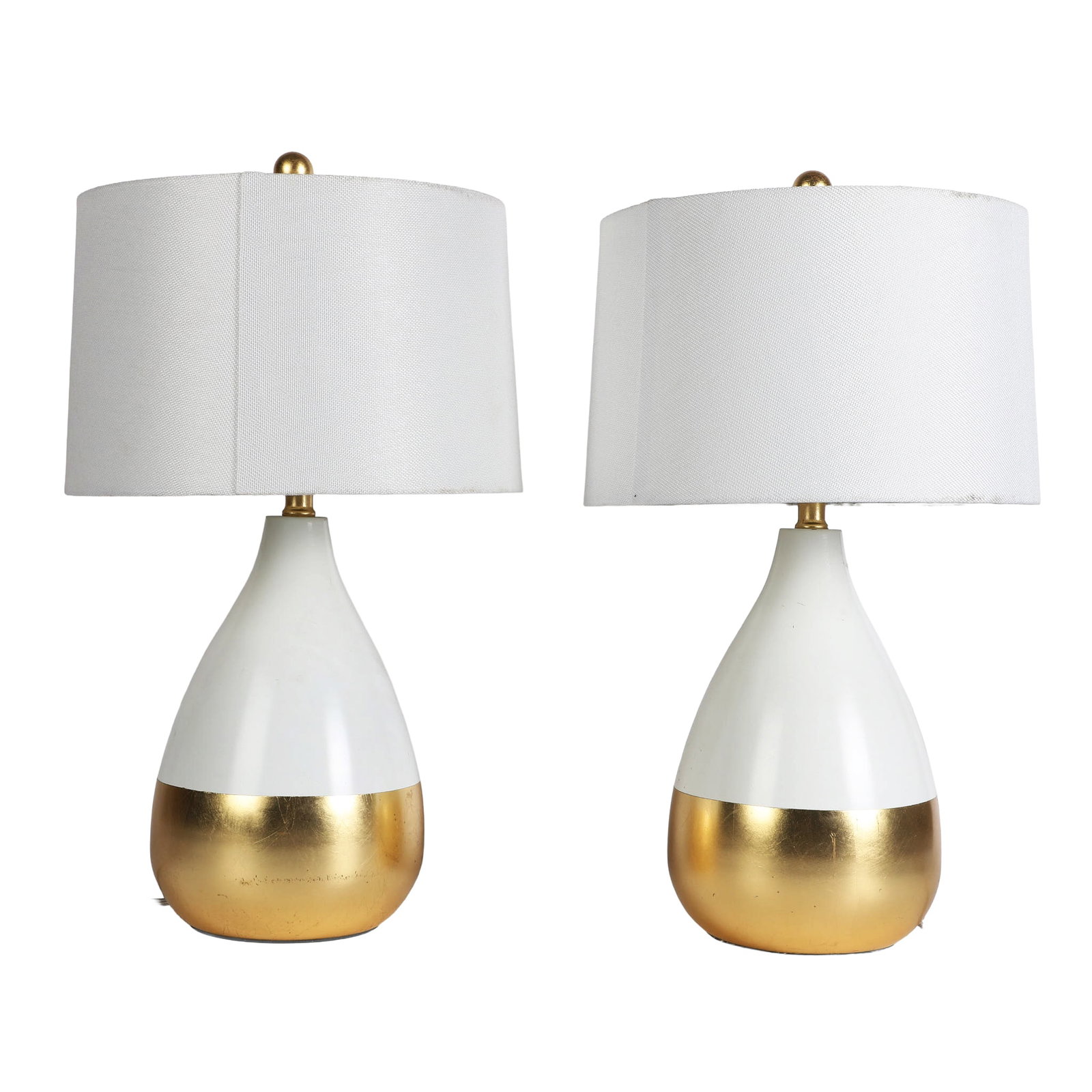 Pair of MCM Safavieh Table Lamps.: Pair of MCM Safavieh Table Lamps. The pair with white drum form shades and white & gold MCM bodies, 24 1/4"H x 13"W