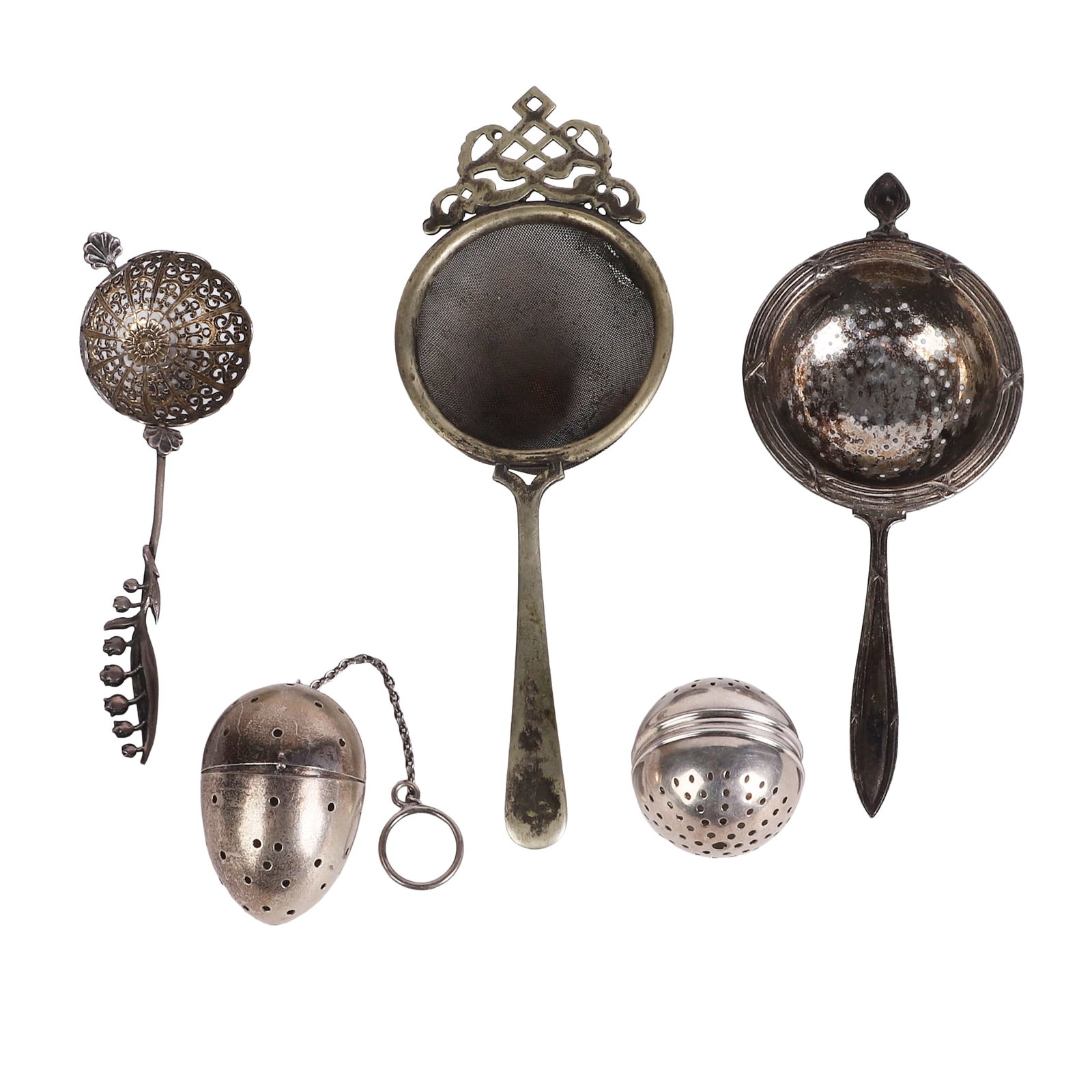 (5) Silver Tea Sieves: (5) Silver Tea Sieves (5) Silver tea sieves with the egg form sieve, floral handle and Whiting sieve noted sterling silver. Weighable 1.865 ozt.