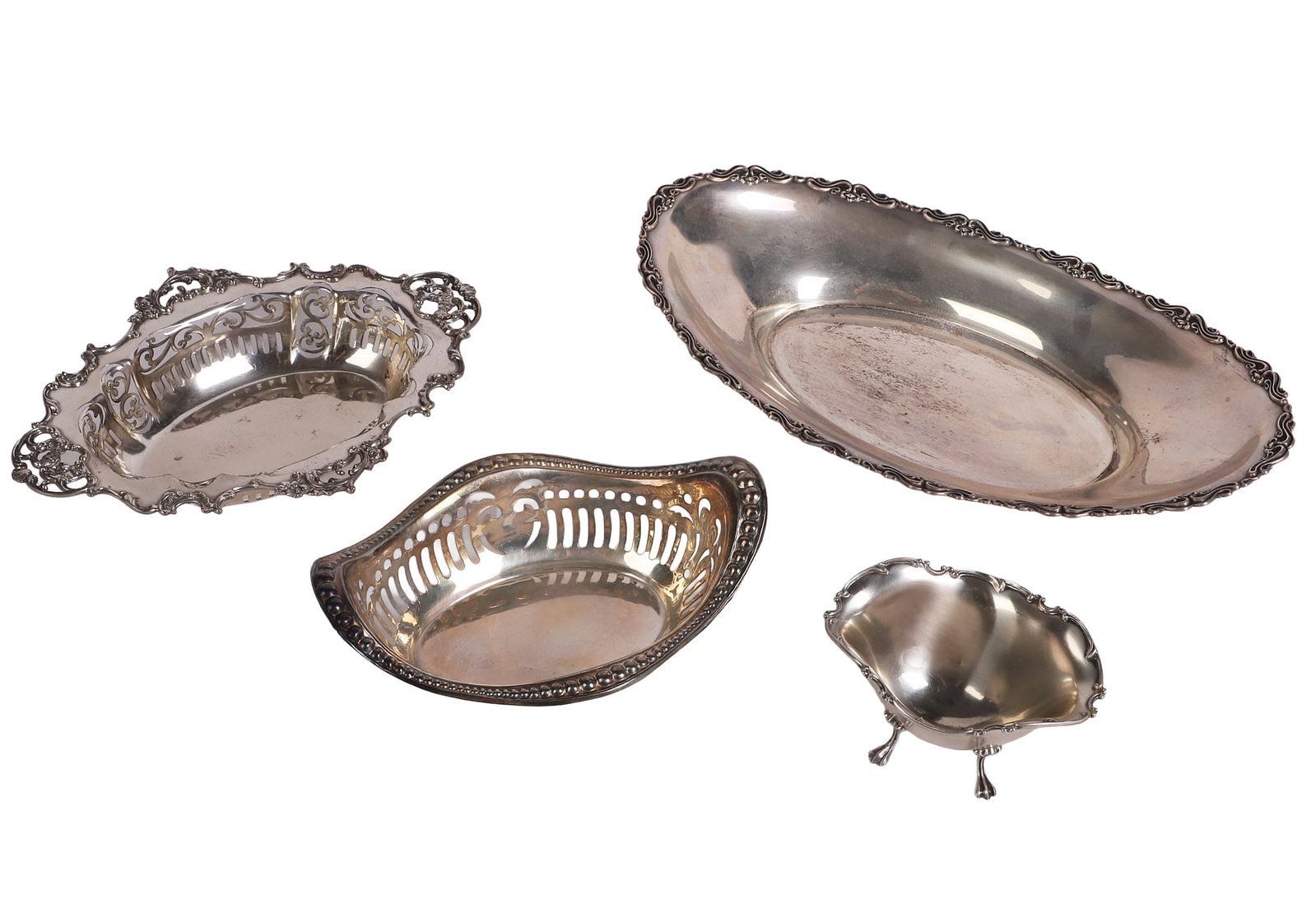 (4) Silver Service Pieces: (4) Silver Service Pieces (3) Sterling silver pieces to include a 12 1/4"L x 7"W Mueck-Carey bread bowl (10.445 ozt), an 8 3/4"L x 6 1/4"W Gorham master nut dish with pierced sides (6.120 ozt) and a