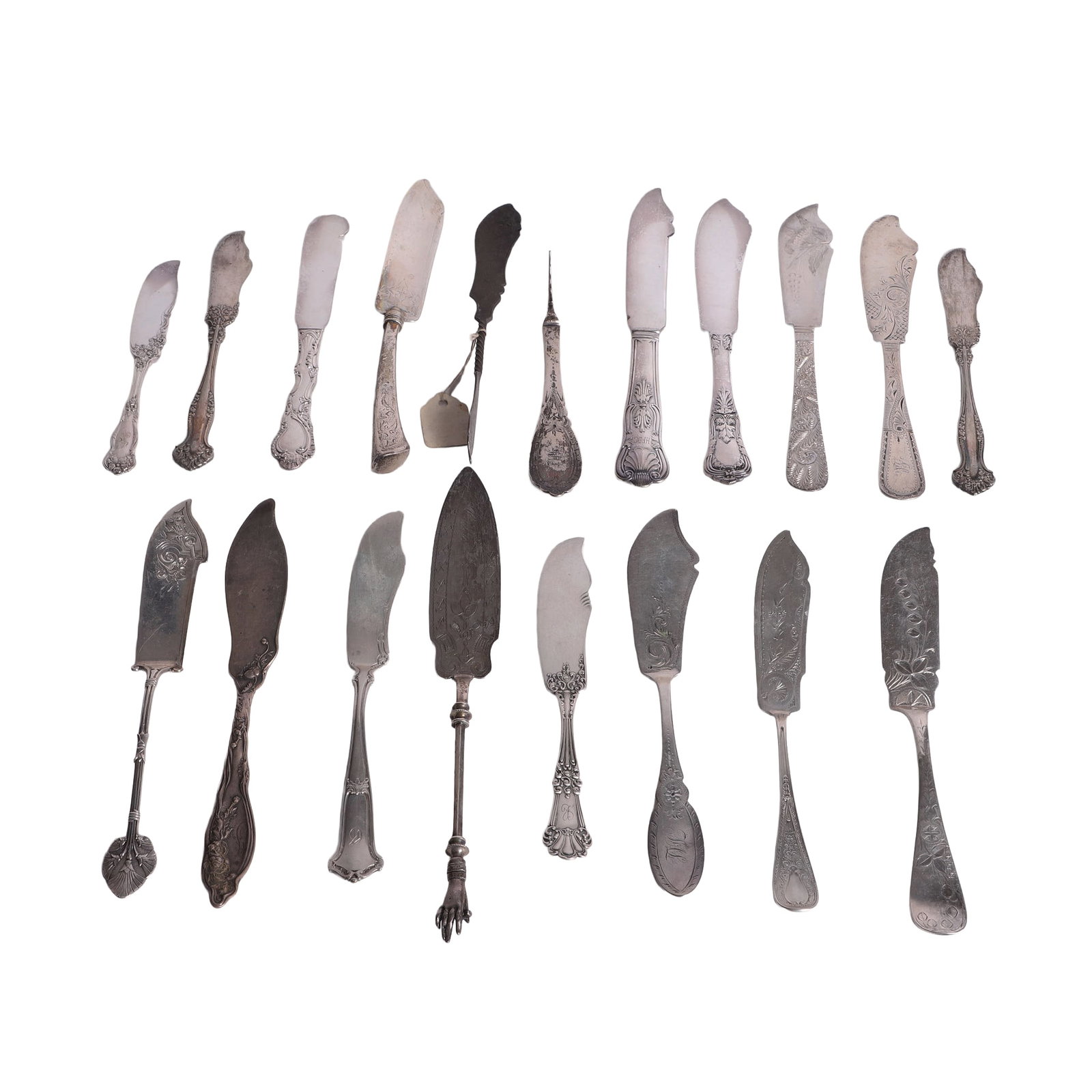 (19) Silver Spreading Knives: (19) Silver Spreading Knives (19) Mix of sterling, coin, and silver plate spreading knives with etched designs & floral motifs from makers like Gorham, Tiffany & Co. and more. Total weighable 12.640 o