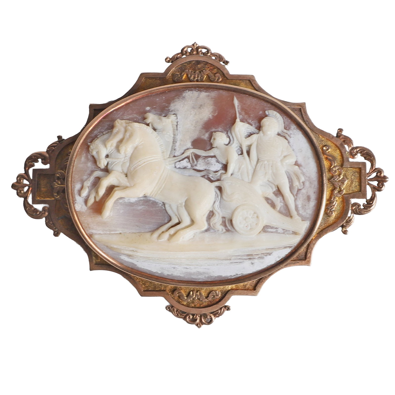 14 K Gold Carved Shell Classical Chariot Cameo Brooch: 14 K Gold Carved Shell Classical Chariot Cameo Brooch 14 K Gold Carved Shell Cameo Brooch with a classical scene showing multiple figures riding a horse drawn chariot, oval cameo is mounted in an orna