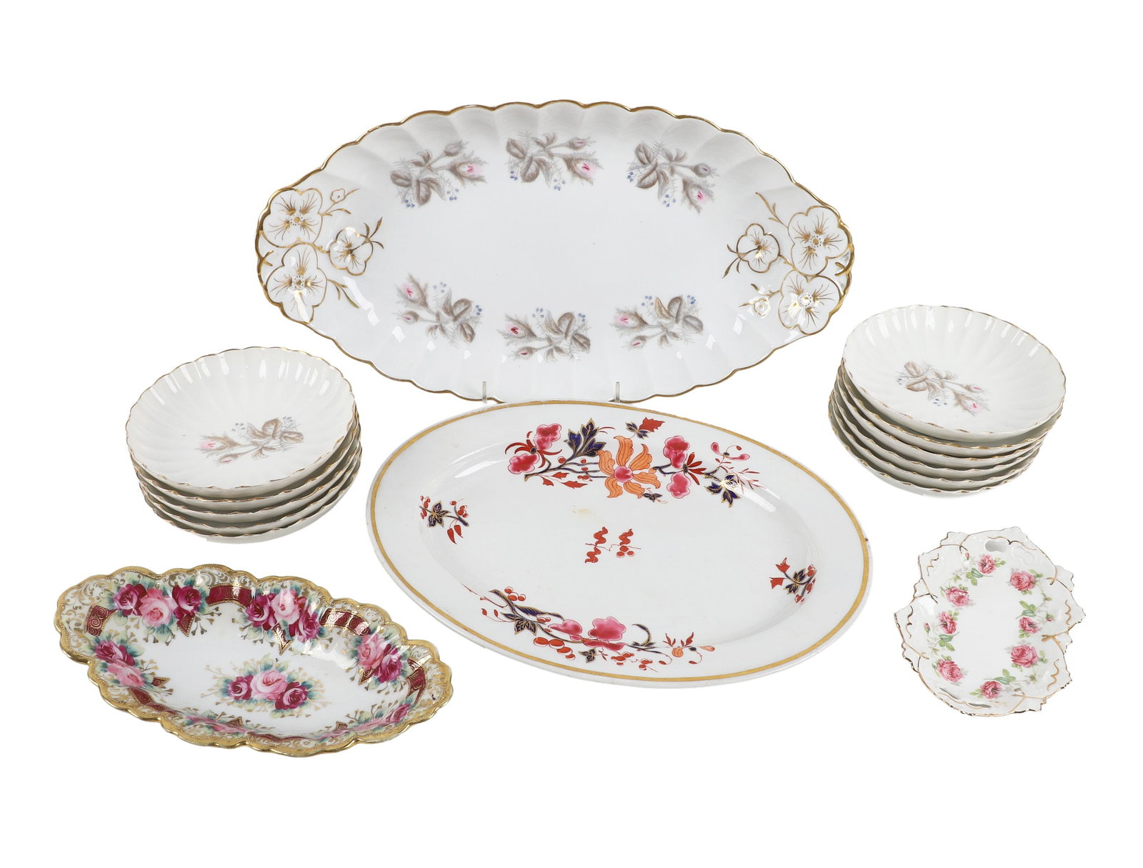 (15) Group of Porcelain Serving Wares: (15) Group of Porcelain Serving Wares (15) Porcelain lot featuring a set of (11) pink floral scalloped rim bowls, 5 1/2"W, with matching 15 1/2"L vegetable bowl; also includes a 12 1/4"W oval serving