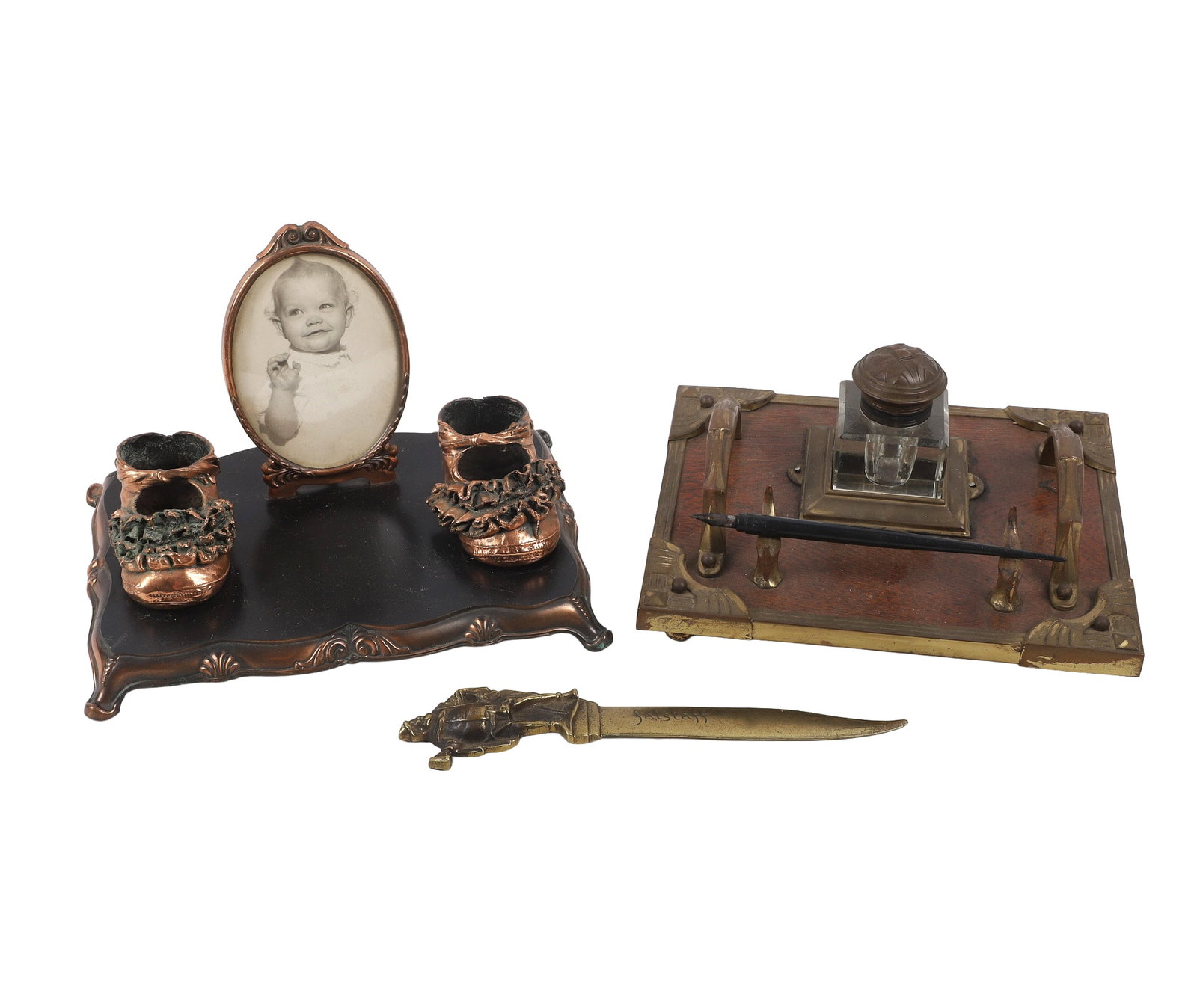 Antique Desk Items Lot: Antique Desk Items Lot 1) 9"W x 6 3/4"L Bronzed baby boots on stand with a a photograph of a baby. 2) 8 1/2"W x 7 1/4"L Travel inkwell with two handles, inkwell & nib. 3) 8 1/2"L Monogrammmed