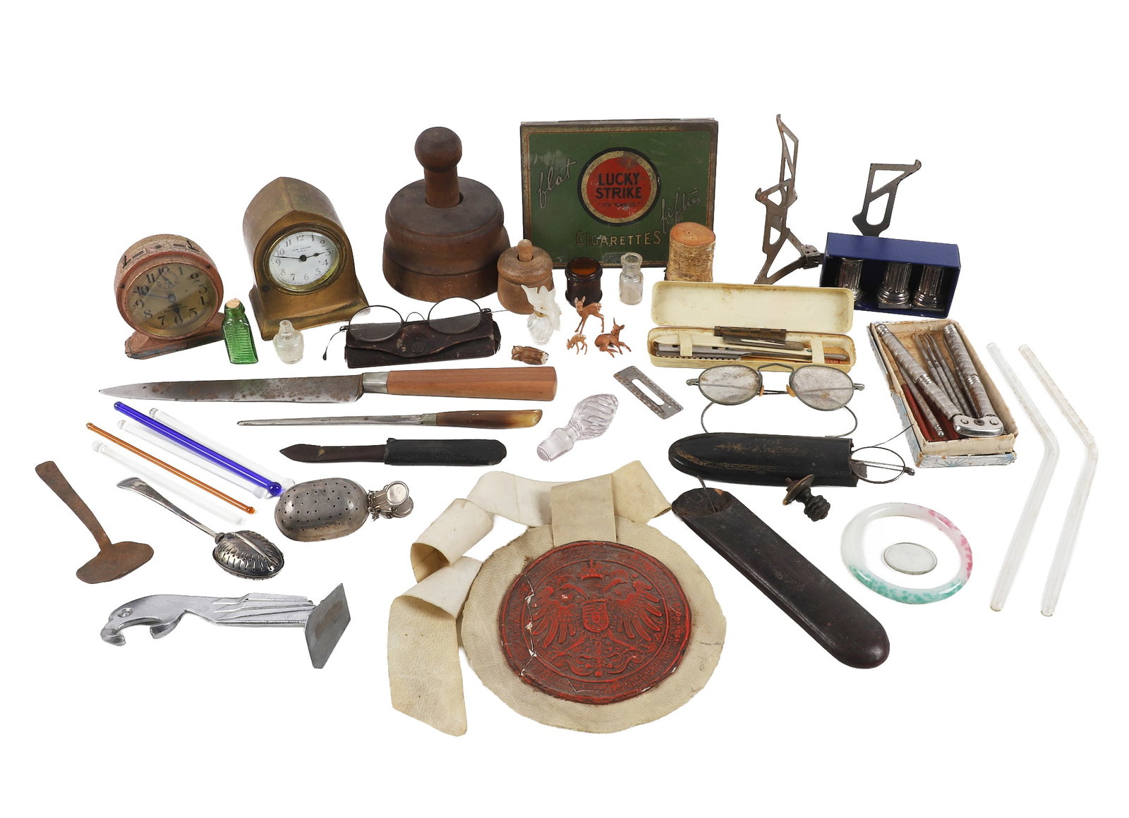 Grandpa's Desk Drawer Lot.: Grandpa's Desk Drawer Lot. Assorted desk items and antique trinkets to include (2) butter molds, (2) small desk clocks from New Haven and Westclox, a vibrant red wax indenture seal, several pairs of r