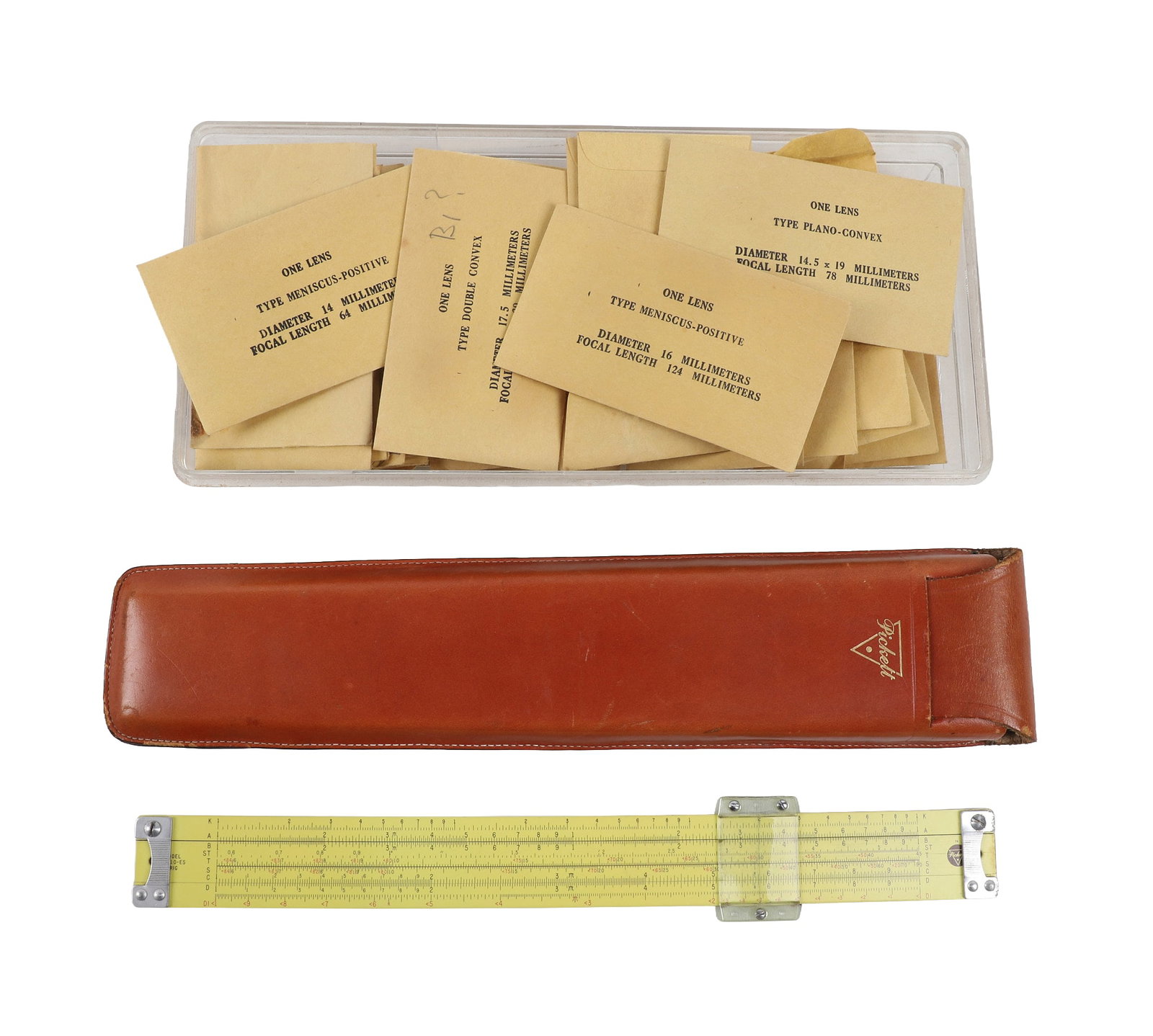 Vintage NOS Lenses & Slide Rule: Vintage NOS Lenses & Slide Rule Variety of NOS lenses in sleeves with a Pickett 272 slide rule in original 13"L leather sheath.