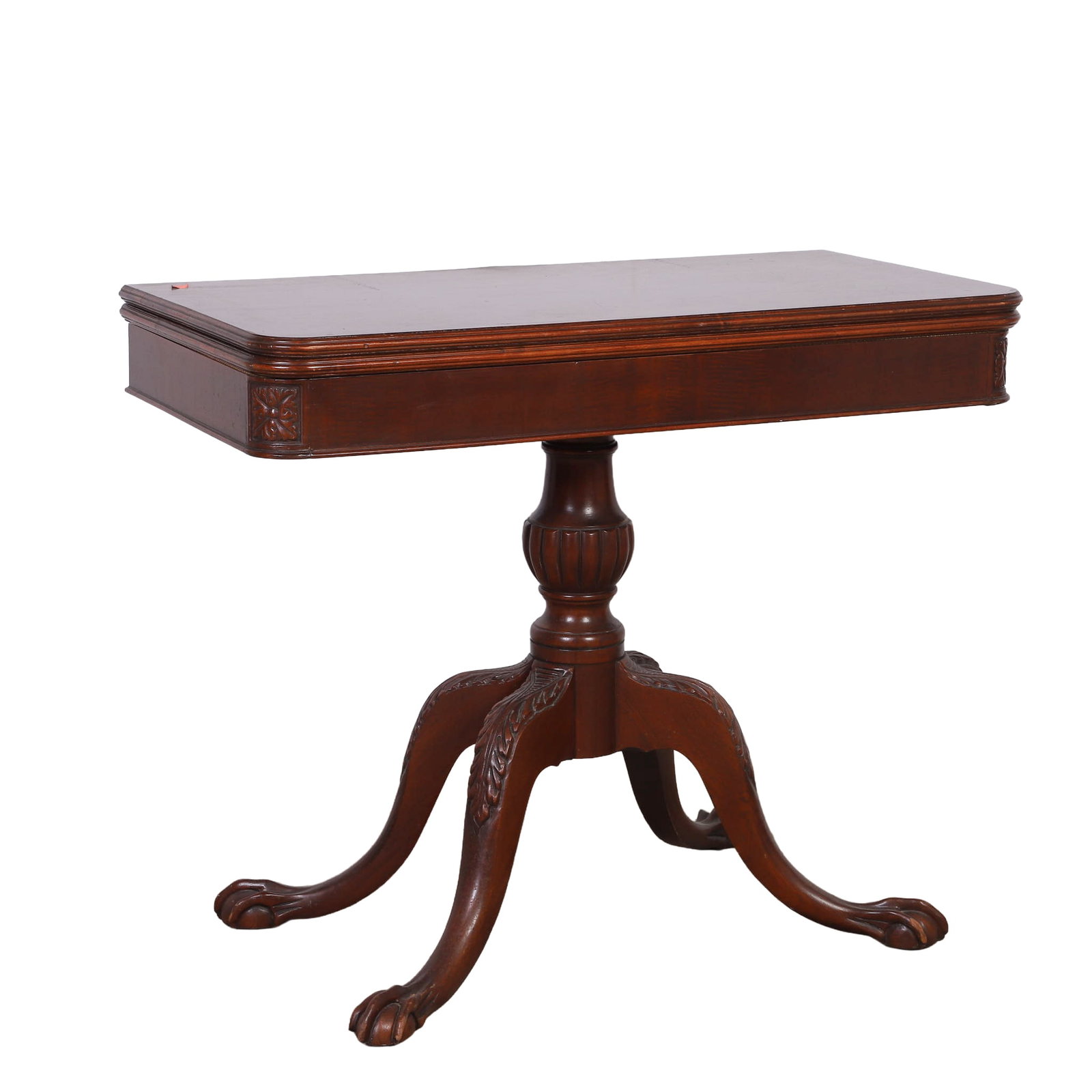 Vintage Chippendale Style Games Table: Vintage Chippendale Style Games Table Mahogany flip top turns to reveal accessory compartment. Sitting atop a pedestal column terminating in acanthus leaf decorated knees and ball and claw feet.