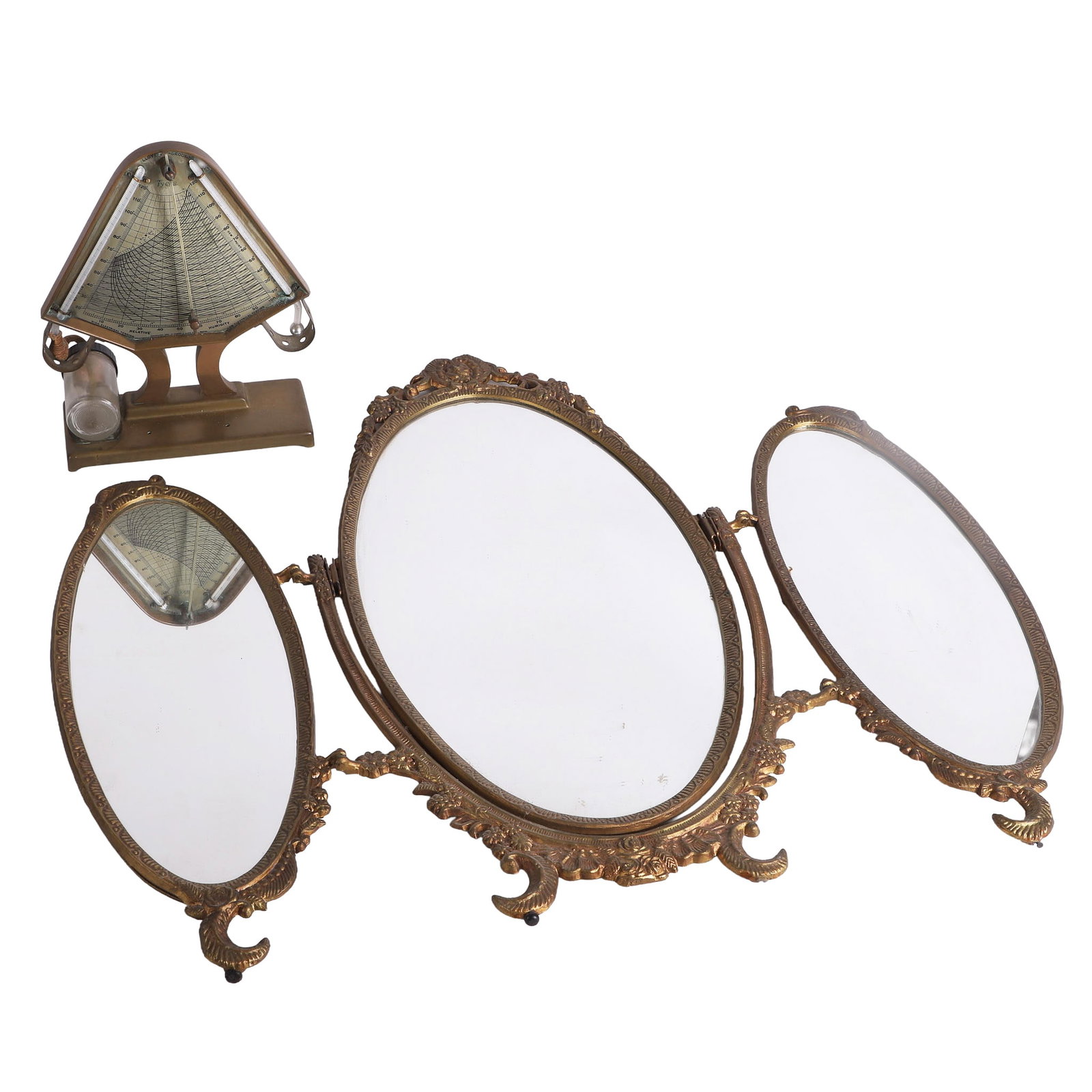 English Tri-Fold Vanity Mirror: English Tri-Fold Vanity Mirror Vintage gilt tri-fold vanity mirror on crescent feet with floral accents, center mirror on hinge. Central mirror 11" x 22", side mirrors 16" x 7", 13 1/2" x 24 1/2" when