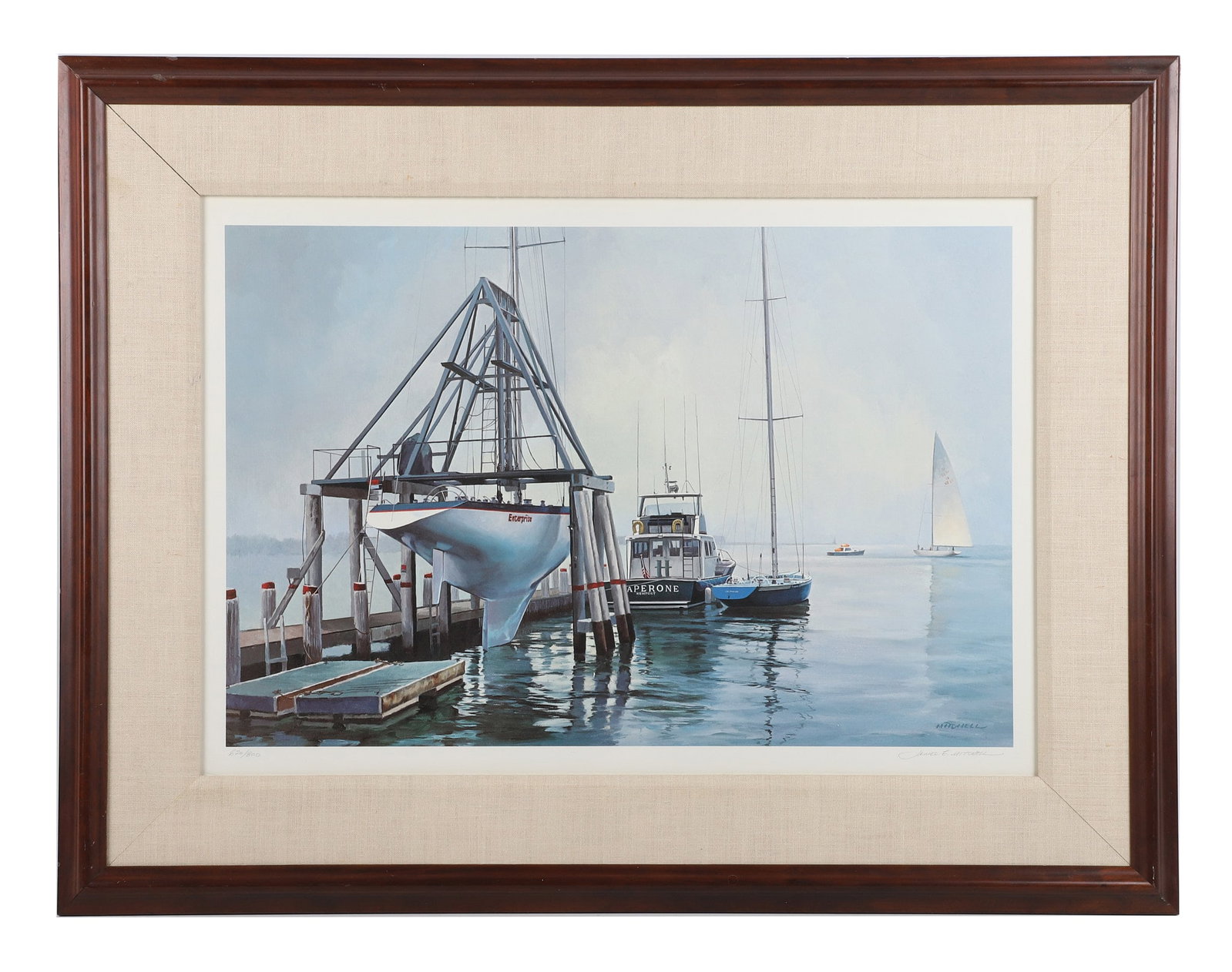 James E Mitchell (American, 20th C) Newport Harbor Dock Scene: James E Mitchell (American, 20th C) Newport Harbor Dock Scene Limited edition print, 520/800, titled "Lay Day, Enterprise and Freedom, 1980 America's Cup." Pencil-signed, numbered, and framed under gl
