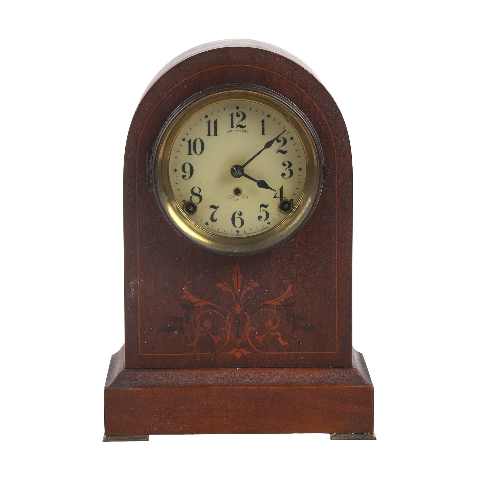 Seth Thomas Tombstone Clock: Antique Seth Thomas round top tombstone mantel clock with wood inlay. Chip noted on back, 13"H x 9"W x 5"D