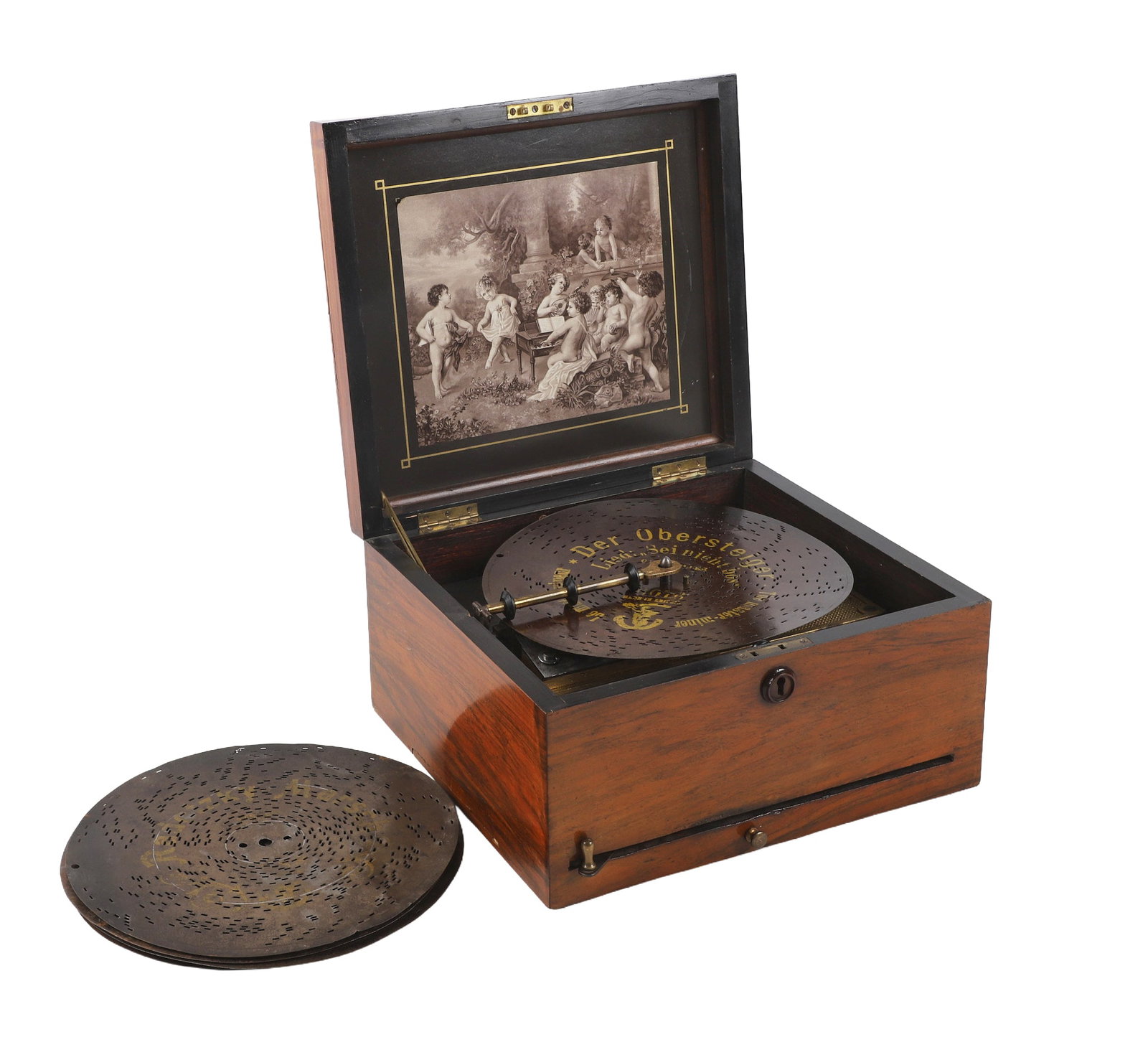 20th C Polyphone 9 5/8" Disc Music Box With Putti Decoration: 20th C Polyphone 9 5/8" Disc Music Box In Inlaid Case With Putti Playing Instruments, along with 6 discs, 7" h x 12"w x 12"d