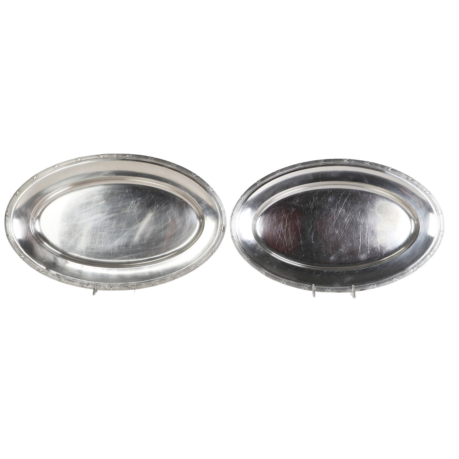 (2) Fracalanza Silver Oval Platters: (2) Pair of matching Brazilian Fracalanza silver plated oval serving platters with reed & ribbon rim, makers marks at underside rim, each 20" x 12 1/2". Some surface scratches