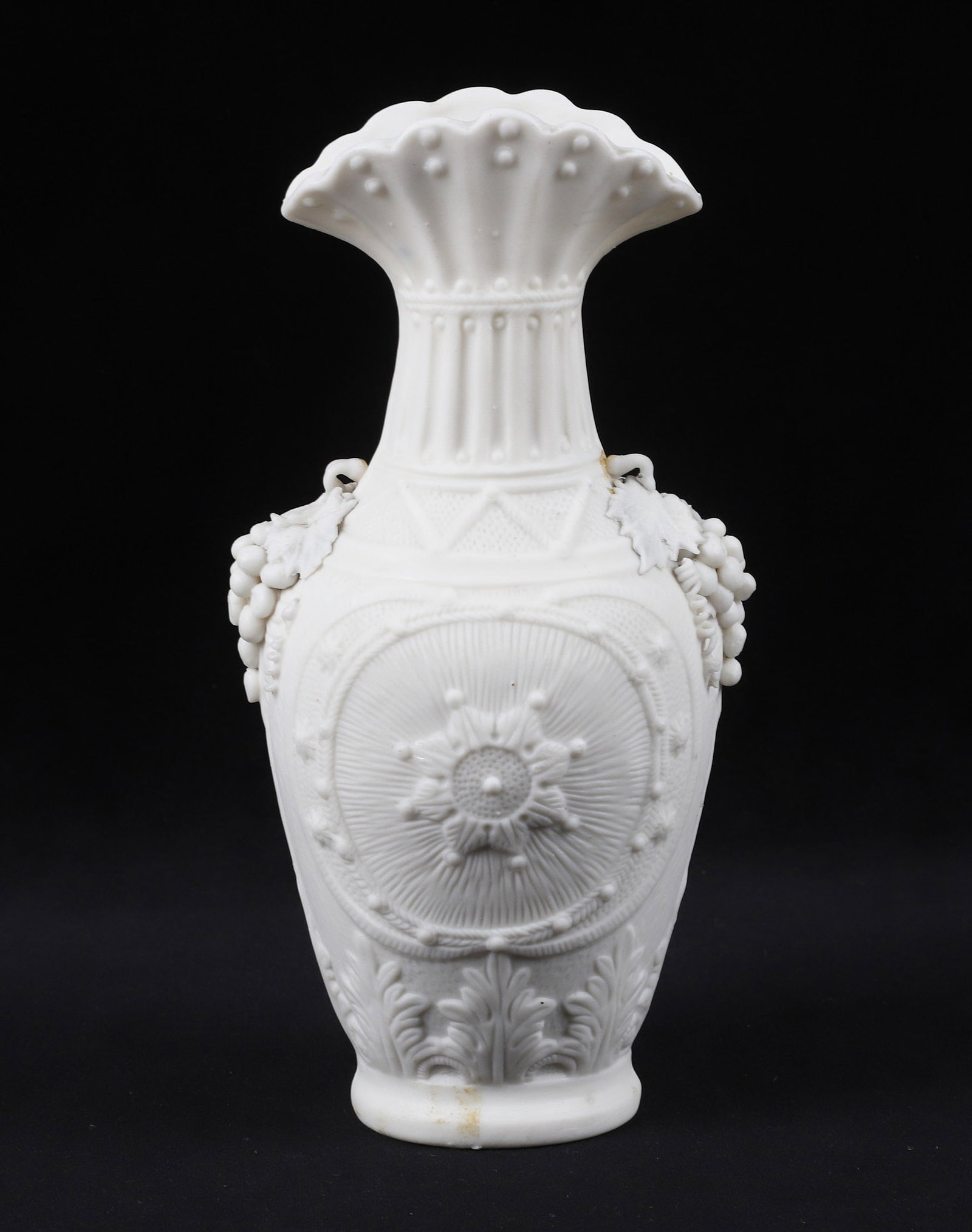Two Antique Bennington Parian Vases: Two Antique Bennington Parian ware, one in all white porcelain vase with with eight-star design and the other in hand painted blue, both with delicate grape accents. 10 3/4"H and 8 1/4"H. Some damage 