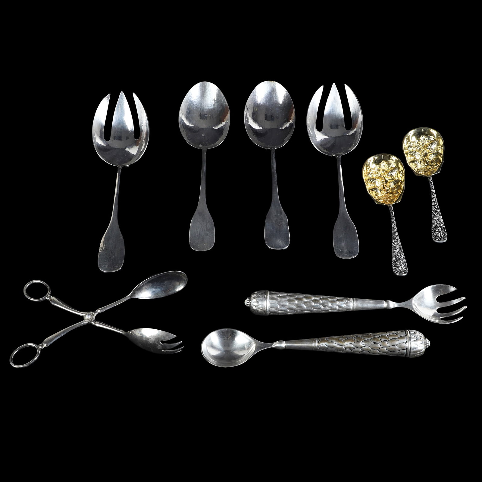 (9) Silver Plated Serving Wares Feat. Marilena Mariotto: (9) Silver Plated Serving Wares Feat. Marilena Mariotto (9) Silver plated serving wares featuring two sets of 13 1/2"L MCM chased serving spoons & forks signed by Marilena Mariotto. Also includes a