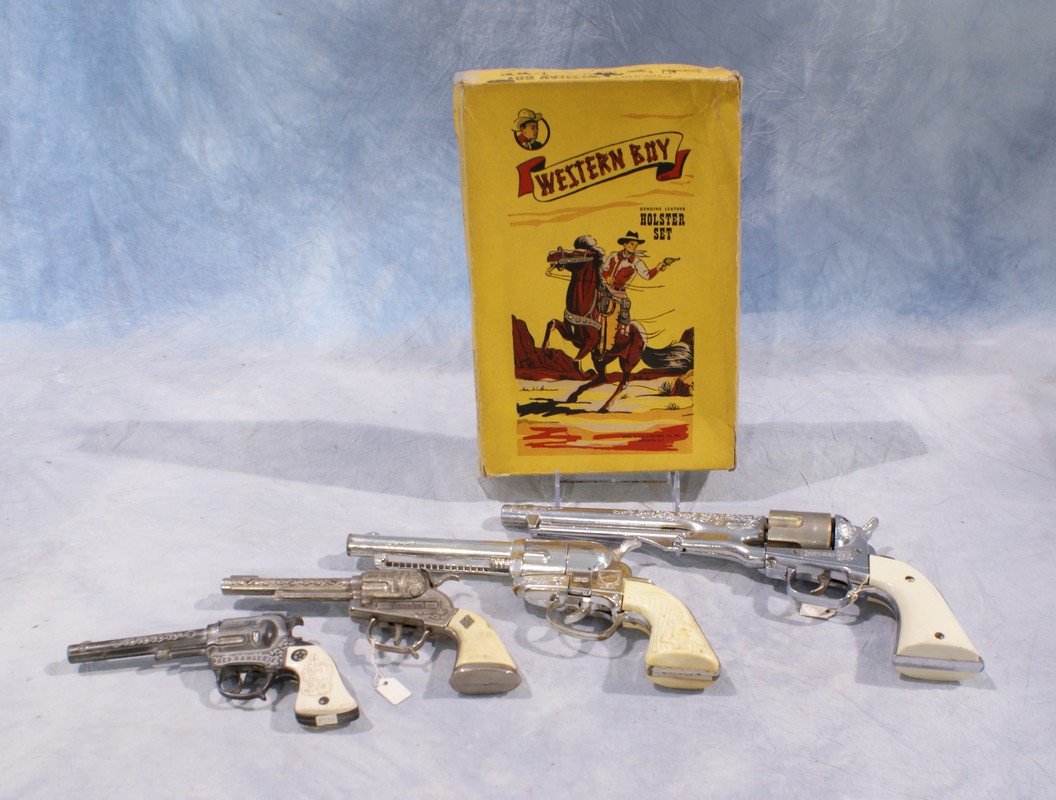 Cap gun lot including (4) cap guns, one marked Red: Cap gun lot including (4) cap guns, one marked Red Ranger Jr, one marked Marshal, largest marked Colt 45, one Fanner 50 by Mattel (butt needs to be reattached), with an empty Western Boy Holster Set b