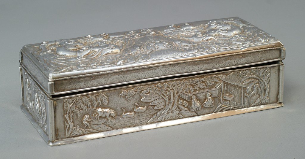 Chinese Export silver repousse box with hinged lid, lid: Chinese Export silver repousse box with hinged lid, lid with dragon, fish, and flaming pearl motif, body with all around landscape decoration, 3 Chinese marks to base, 8 3/4" long, 3 5/8" d, 2 1/2" h,