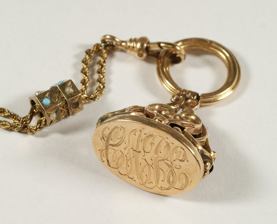 10K YG & YGF watch fob and chain with slide, fob tests: 10K YG & YGF watch fob and chain with slide, fob tests as 10K, 3.8 dwt, with 3 letter mono, 50" YGF chain with slide set with stones, one missing,