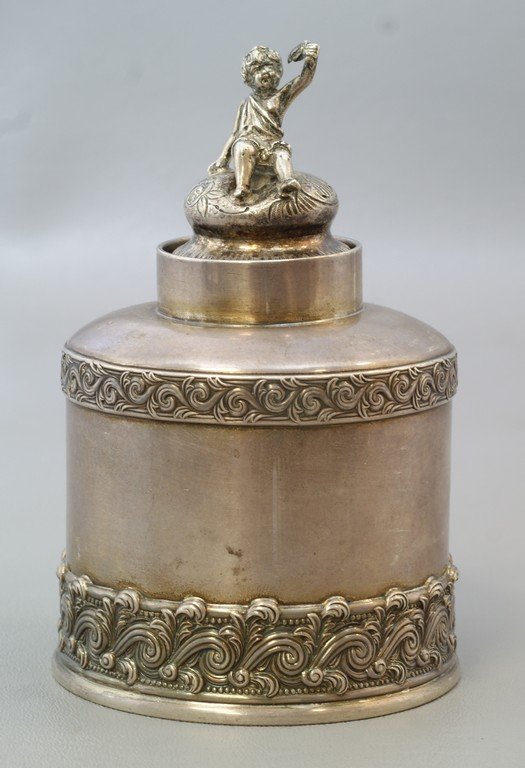Tiffany & Co Makers sterling silver tea jar, ocean wave: Tiffany & Co Makers sterling silver tea jar, ocean wave pattern, 7623 / 989, with a mismatched unmarked cherub lid, the jar 3 3/4" h, 8.56 TO