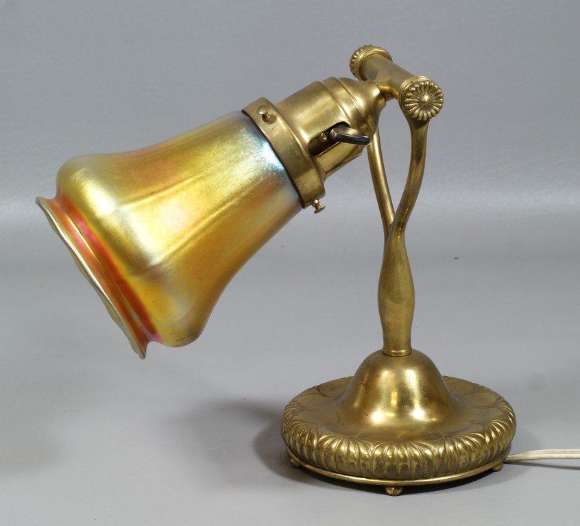 Bronze Tiffany Studios Nautilus desk lamp base fitted: Bronze Tiffany Studios Nautilus desk lamp base fitted with an LCT favrile shade, base numbered D797, 9 "tall