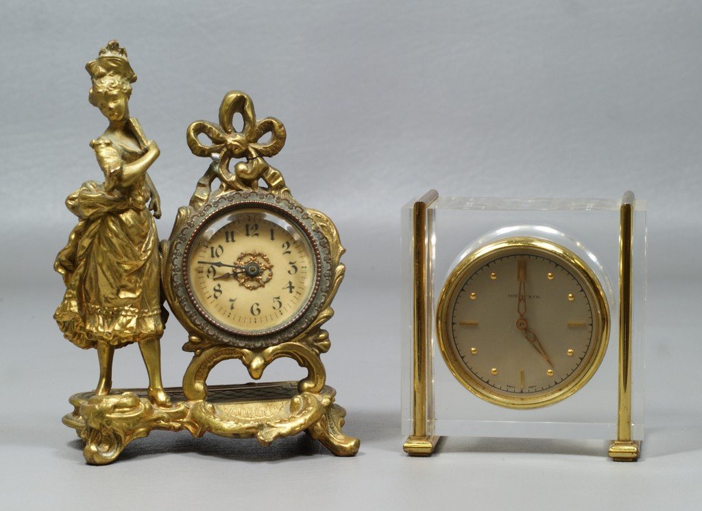 Figural Victorian style desk clock, 6 "tall, with a: Figural Victorian style desk clock, 6 "tall, with a Tiffany & Co lucite desk clock, 4" tall, neither running