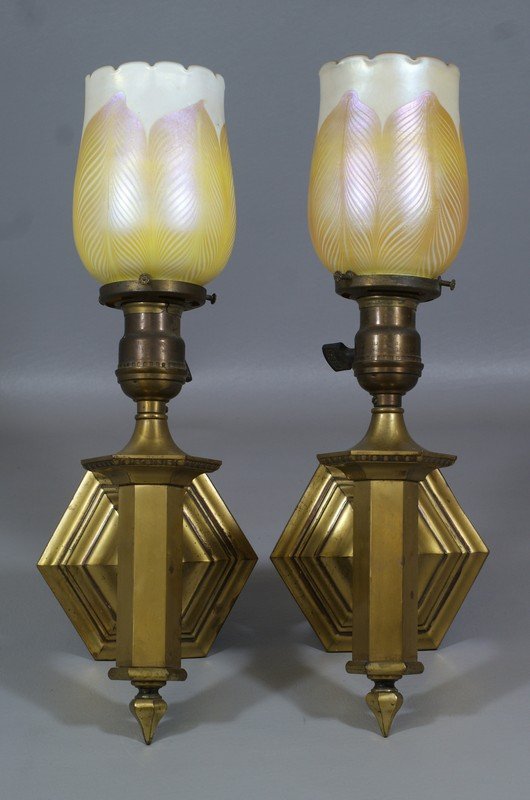 Pr brass wall sconces with pulled feather Quezal: Pr brass wall sconces with pulled feather Quezal shades, one shade with crack top to bottom, shades 5 " tall
