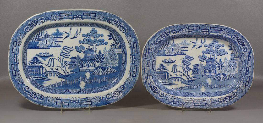 2 English Staffordshire Blue Willow Platters, largest: 2 English Staffordshire Blue Willow Platters, largest 17-1/2" wide, marked "Stone China", the smaller 15", marked "Staffordshire Stone China"