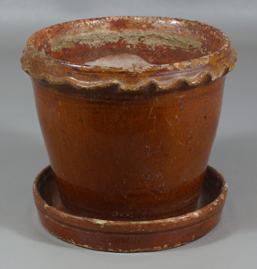 Pennsylvania glazed Redware flower pot with crimped rim: Pennsylvania glazed Redware flower pot with crimped rim an connected saucer base, 6 " dia x 5 1/2" h