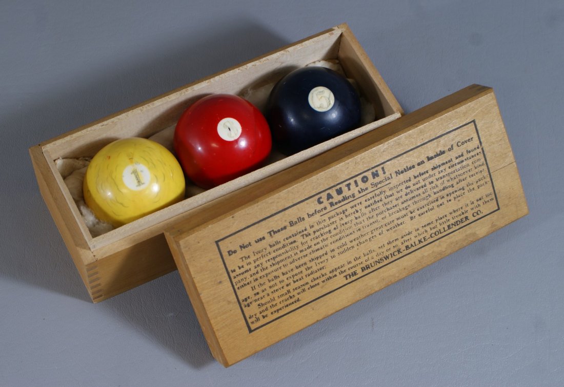 (3) Stained ivory billiard balls, in original wooden: (3) Stained ivory billiard balls, in original wooden box, Brunswick-Balke-Collender Co, approx 2" dia each. We adhere strictly to all state and Federal laws pertaining to the sale, shipping, and expor
