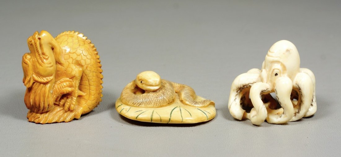 (3) carved ivory Japanese netsuke, octopus, snake,: (3) carved ivory Japanese netsuke, octopus, snake, dragon, 1 signed, tallest 1 1/2". We adhere strictly to all state and Federal laws pertaining to the sale, shipping, and export of any items containi