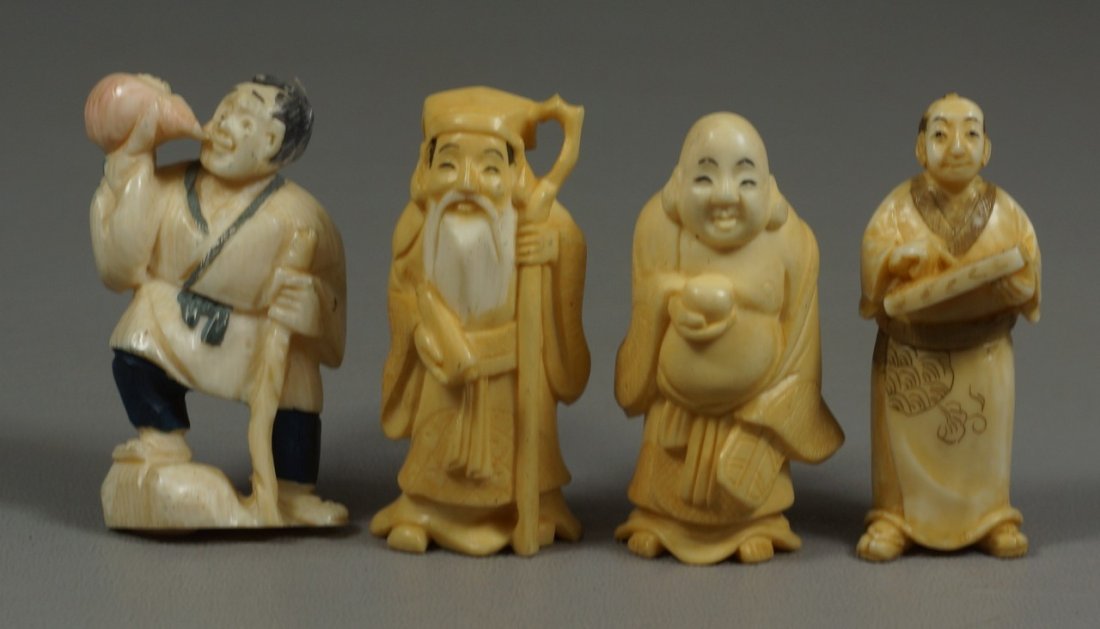 (4) carved ivory Japanese netsuke, figures holding: (4) carved ivory Japanese netsuke, figures holding various objects, two signed, tallest 2". We adhere strictly to all state and Federal laws pertaining to the sale, shipping, and export of any items c