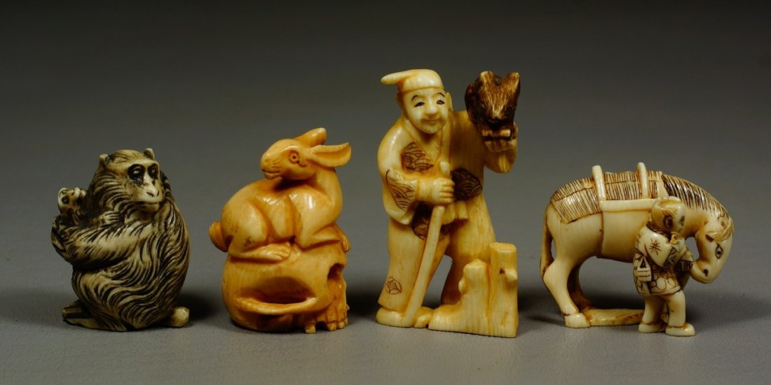 (4) carved ivory Japanese netsuke, figures holding: (4) carved ivory Japanese netsuke, figures holding horse & rabbit, monkey, rabbit, all signed, tallest 2 1/4". We adhere strictly to all state and Federal laws pertaining to the sale, shipping, and ex