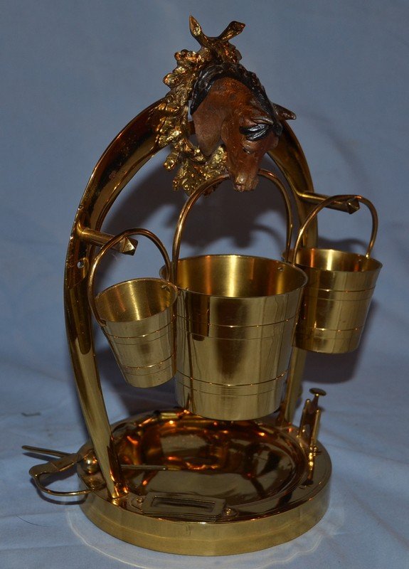 Equestrian motif brass smoke stand with cigar cutter.: Equestrian motif brass smoke stand with cigar cutter.