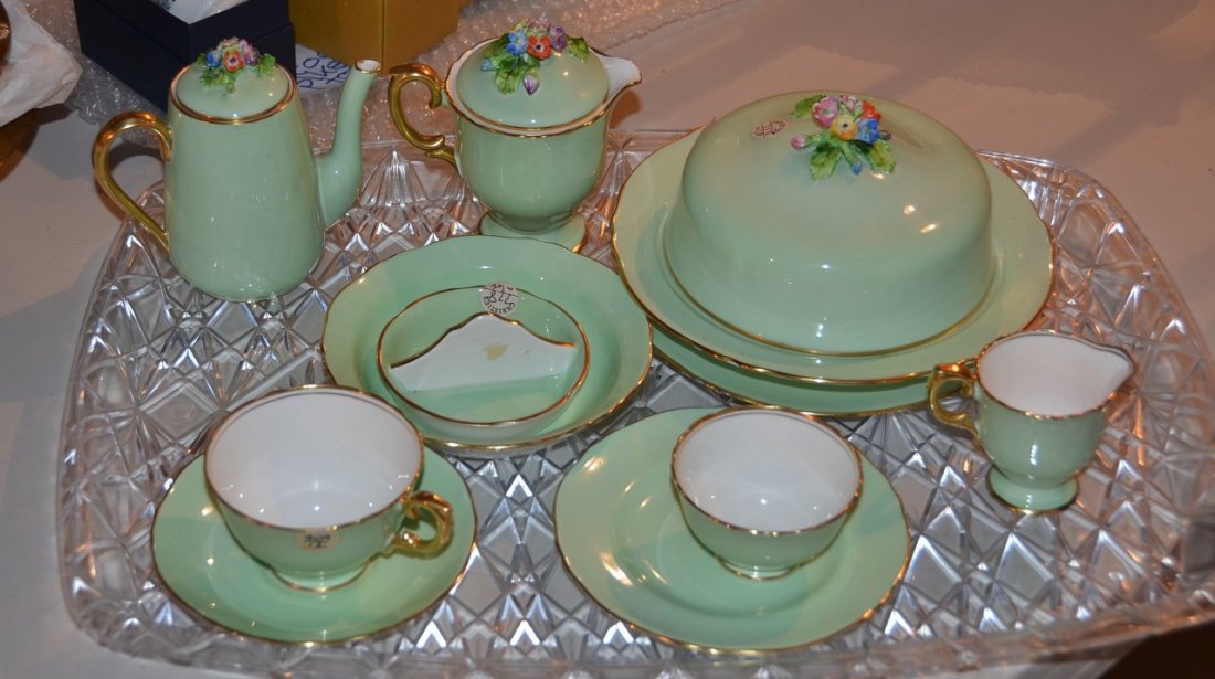 11 piece Staffordshire breakfast set, consisting of: 11 piece Staffordshire breakfast set, consisting of teapot, creamer, milk pot, covered cereal dish, plates, bowls, cups, and saucers.