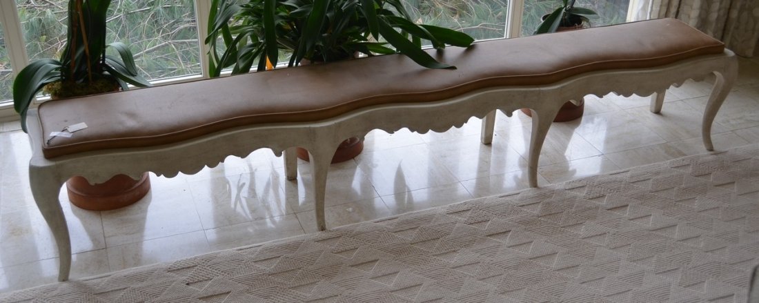 White painted Italian Provincial style window bench: White painted Italian Provincial style window bench with tan leather seat, serpentine front rail, 96" l x 15" d x 16" h