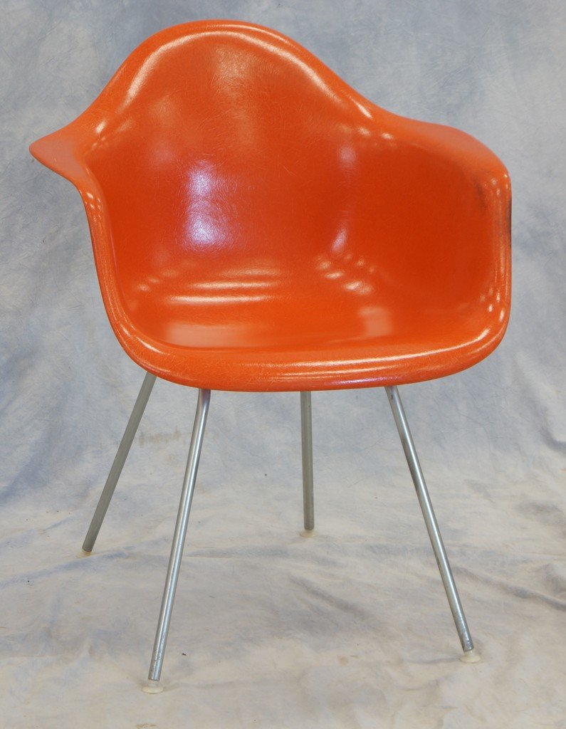 Charles Eames orange molded fiberglass armchair by: Charles Eames orange molded fiberglass armchair by Herman Miller
