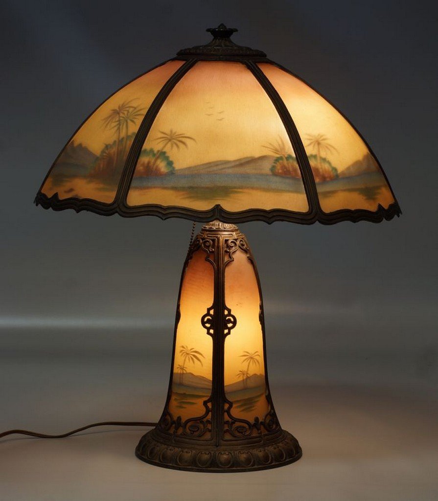 Pittsburgh type reverse painted table lamp with desert: Pittsburgh type reverse painted table lamp with desert scene in 6 panel shade and in the base, unsigned, no damage, 19 1/4" d, 22" tall