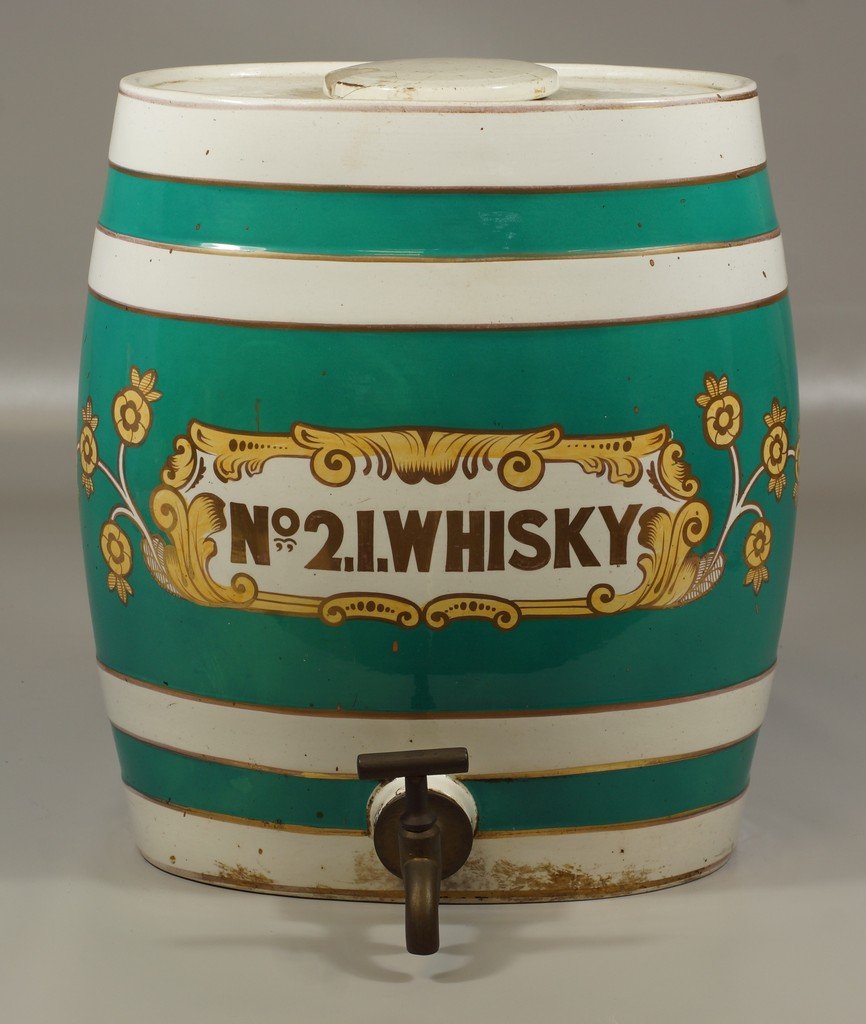 Ironstone No 2 Irish Whiskey dispenser, brass spigot,: Ironstone No 2 Irish Whiskey dispenser, brass spigot, ironstone lid (damaged), spider hairlines in base, 15 3/4" tall, 12 1/2" w