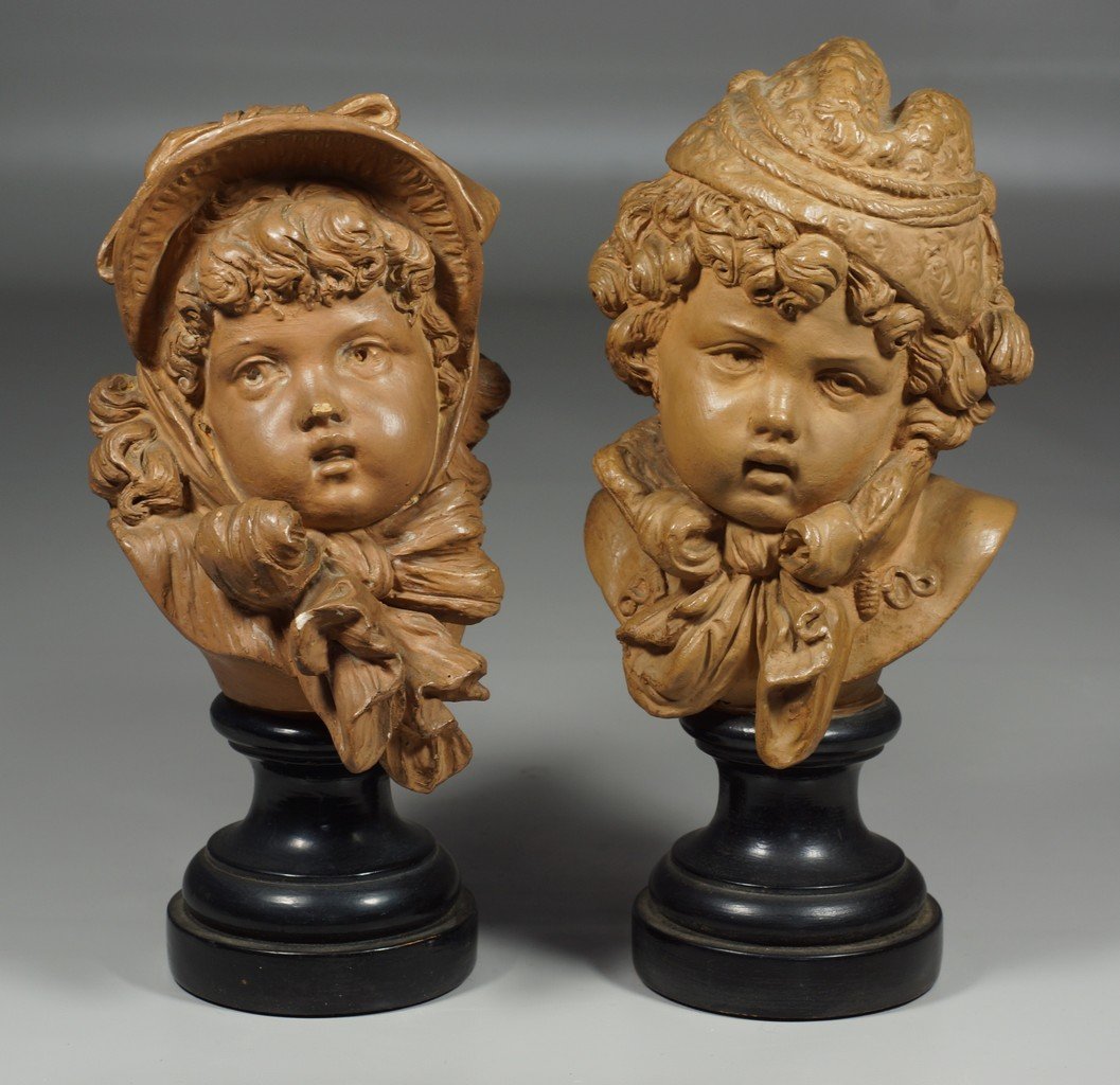 Pr E Guillemin earthenware busts of children, rear: Pr E Guillemin earthenware busts of children, rear impressed with artist name, E Guillemin, Quai Jemmapes 6 (Paris), on black socle bases, chip to rear of one base, 8 1/2" tall