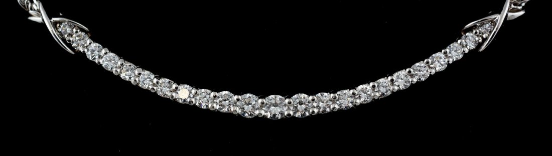 Platinum and 18K YG diamond necklace, 23 full cut: Platinum and 18K YG diamond necklace, 23 full cut diamonds from 6 pt to 15 pt ea, 1.74 ct tdw, set in a platinum crescent center, on an 18K YG rhodium finished foxtail chain, 15" long