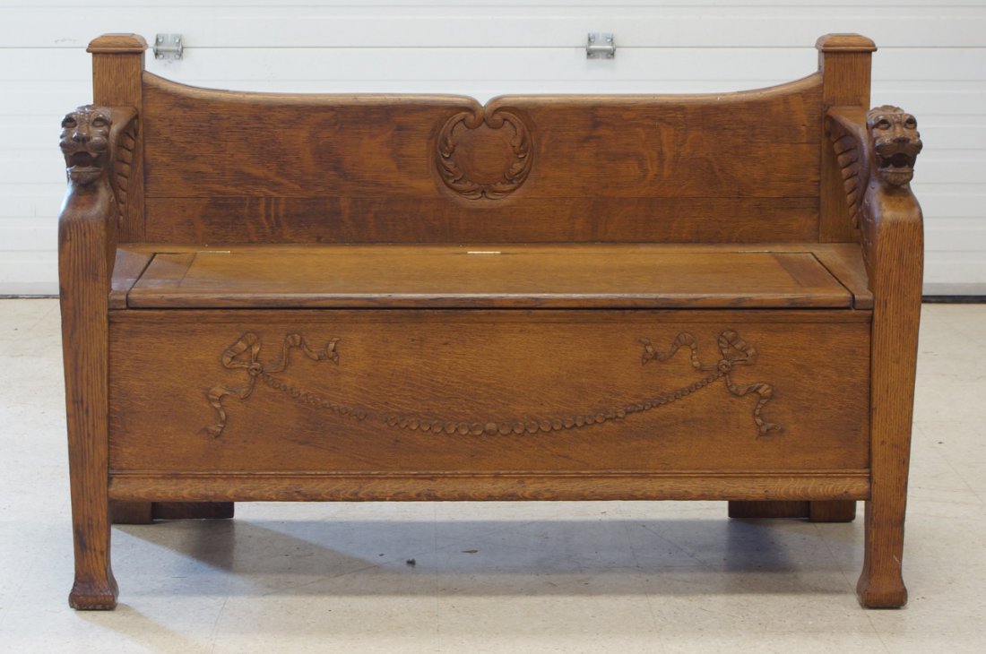 Carved oak hall bench with lion head arms, lift seat,: Carved oak hall bench with lion head arms, lift seat, 20" d, 30-3/4"h, 48" w
