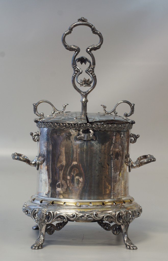 Plated silver egg cooker with double compartment top,: Plated silver egg cooker with double compartment top, removable holder for 12 eggs, 1865 presentation engraving, some dents, unmarked, 16 3/4" tall