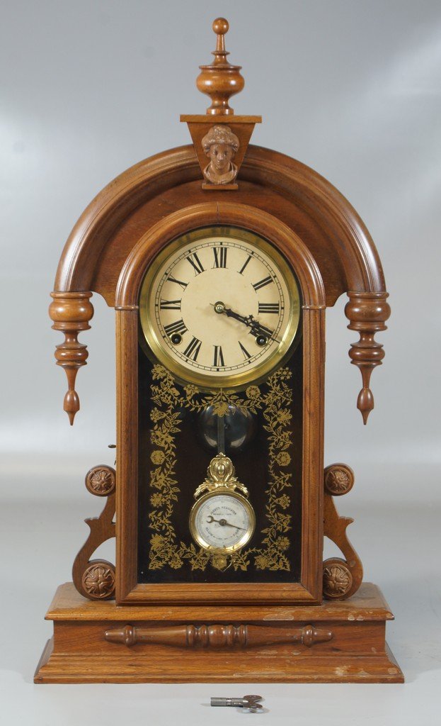 Walnut Victorian Shelf Clock with Ansonia head crest,: Walnut Victorian Shelf Clock with Ansonia head crest, 24" tall